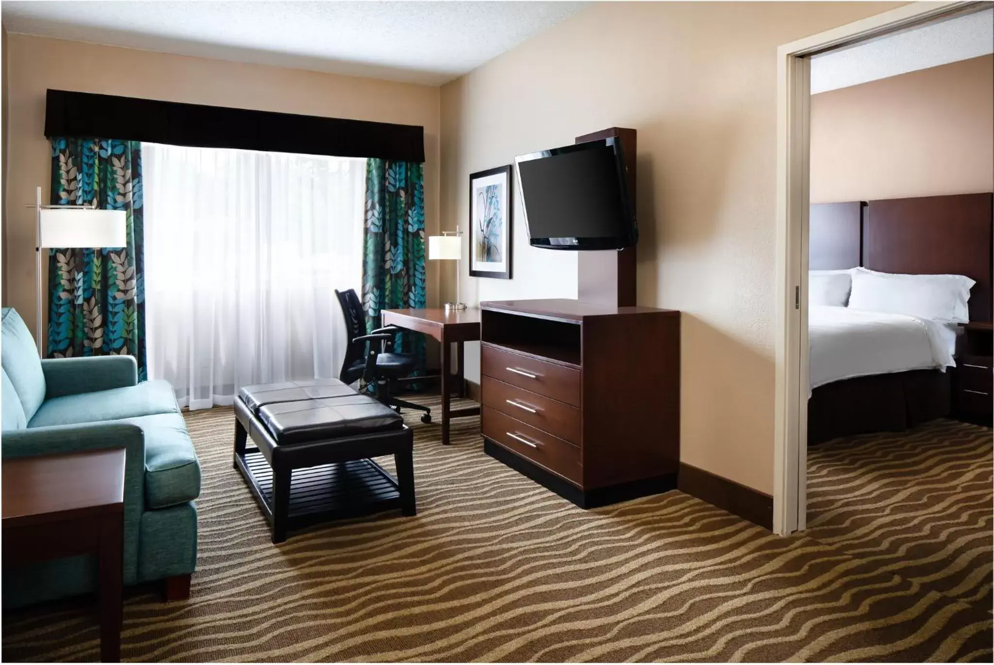 Photo of the whole room, TV/Entertainment Center in Holiday Inn Hotel & Suites Overland Park-West, an IHG Hotel
