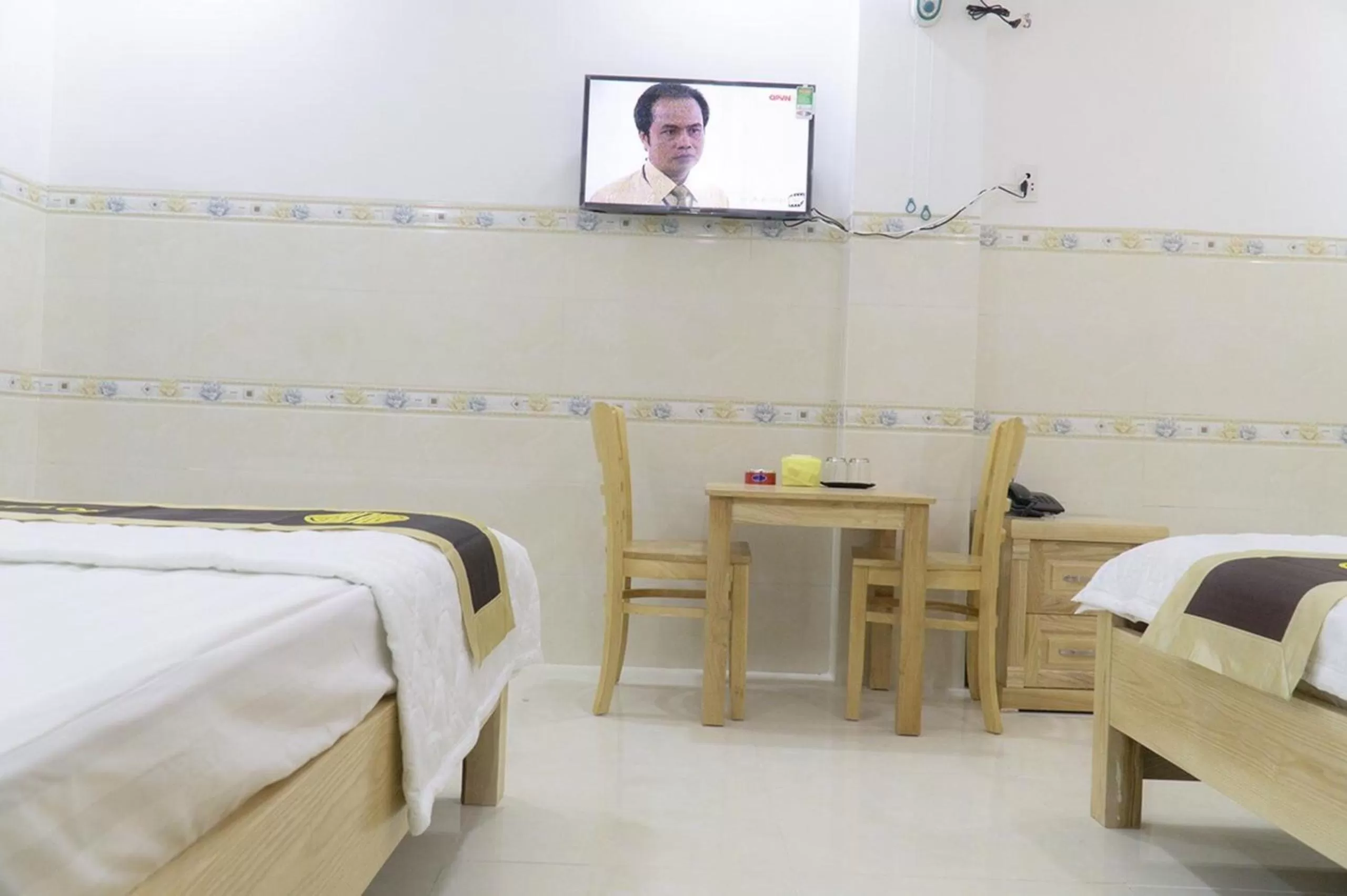 TV and multimedia, Bed in Dai An Binh Tan Hotel