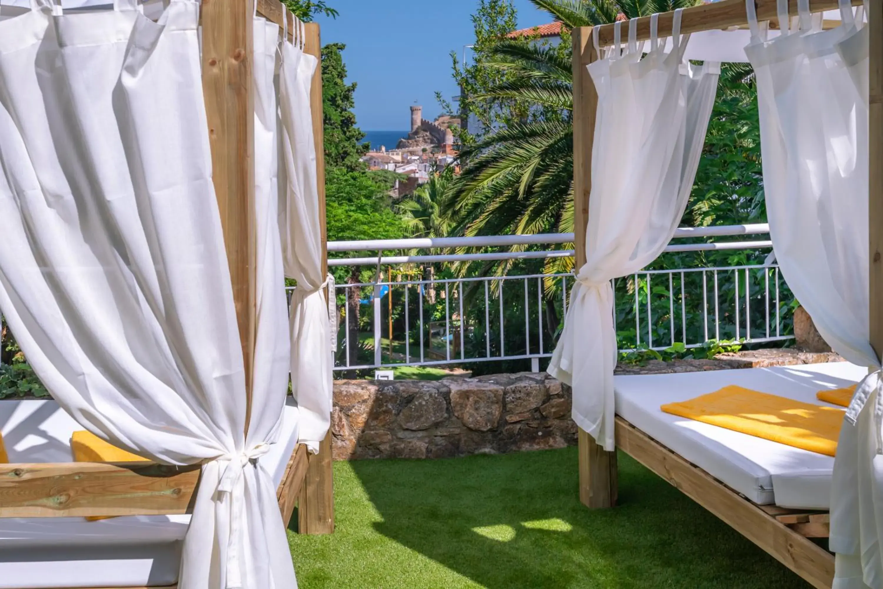 Patio, Bed in Hotel GHT Neptuno-Tossa & Venus SPA Patio, Bed in Hotel GHT Neptuno-Tossa & Venus SPA