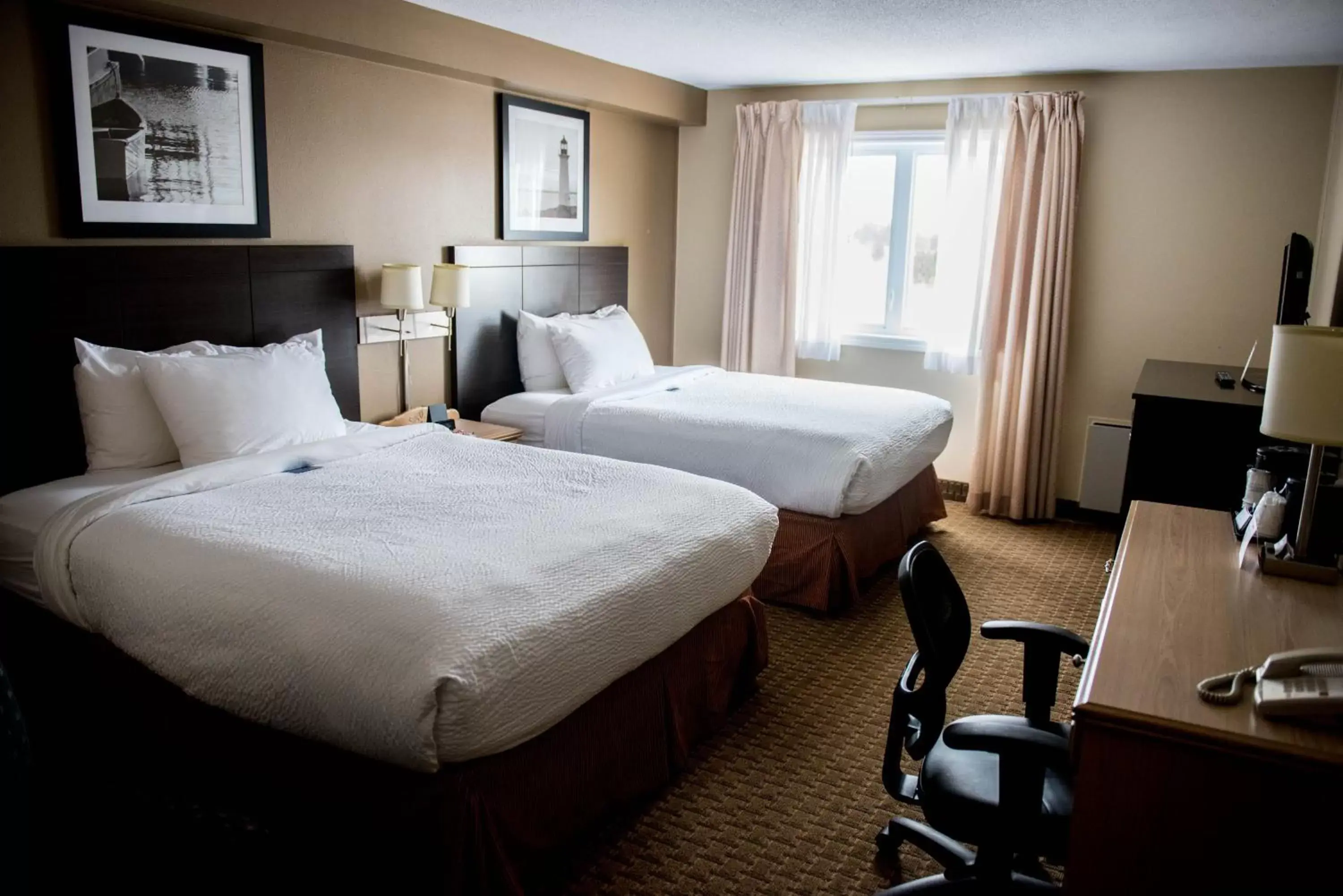 Bed in Travelodge Suites by Wyndham Moncton