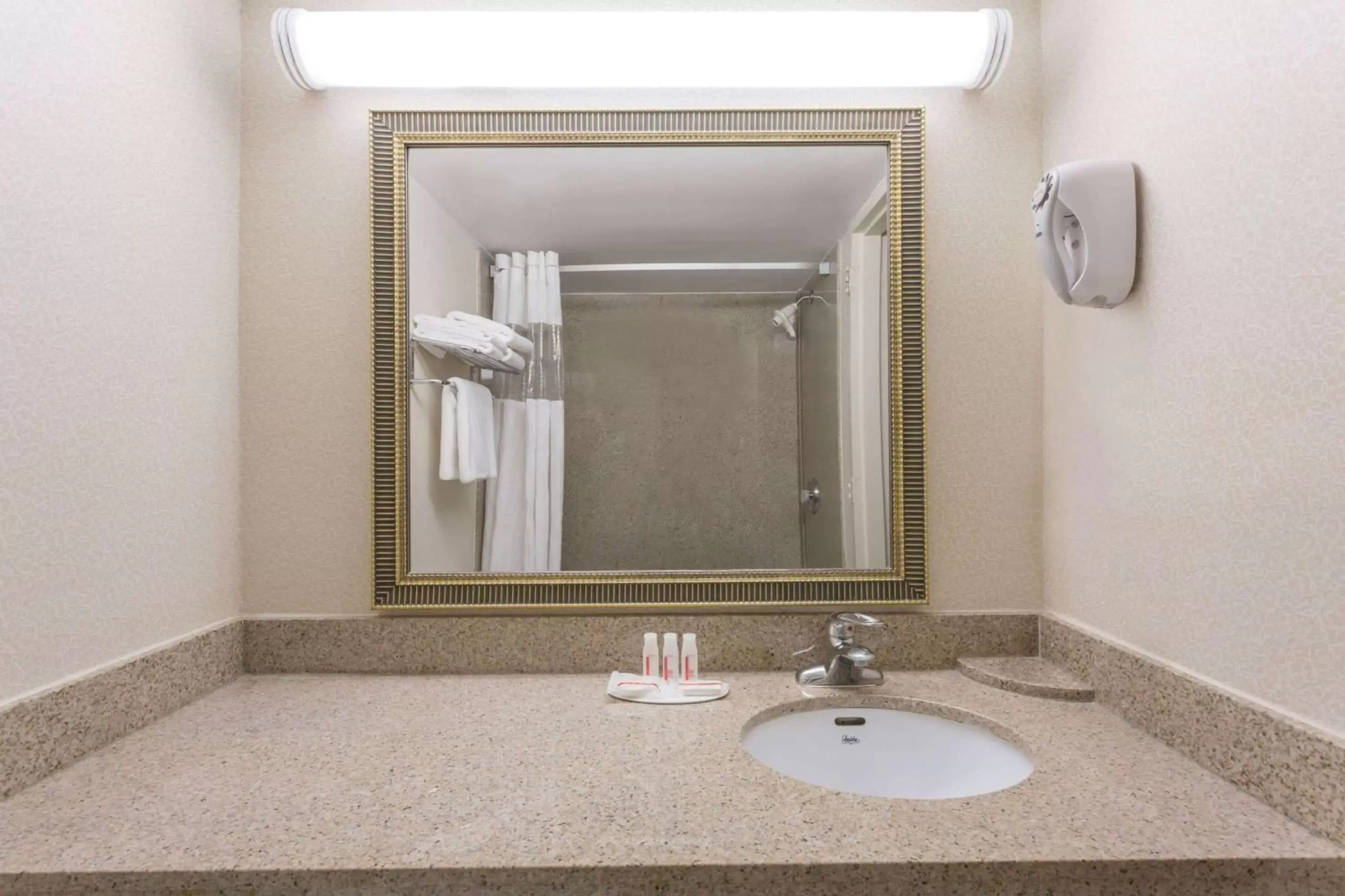 Bathroom in Ramada by Wyndham Triangle/Quantico