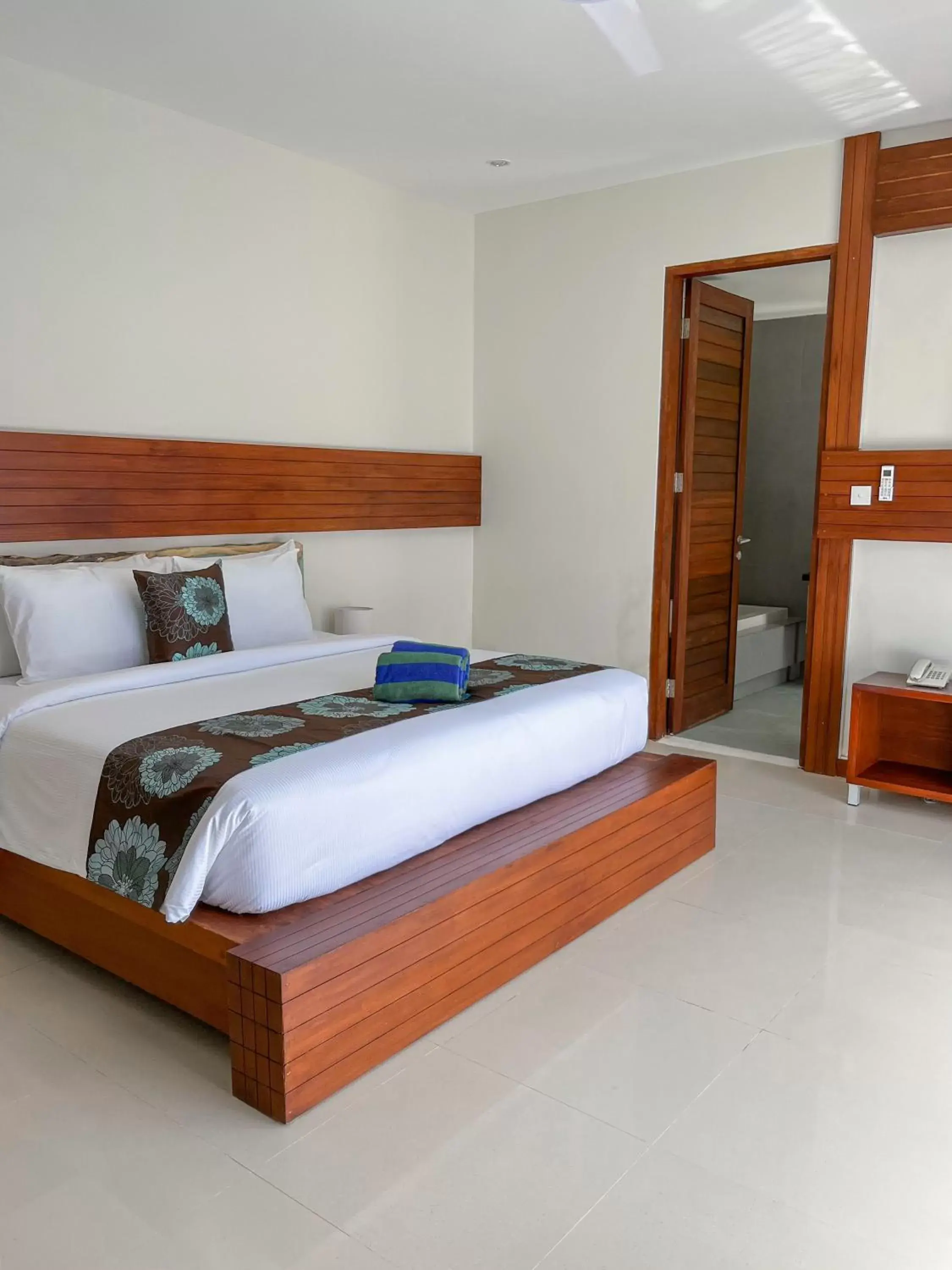 Bed in Taj Maza Sunset Villas