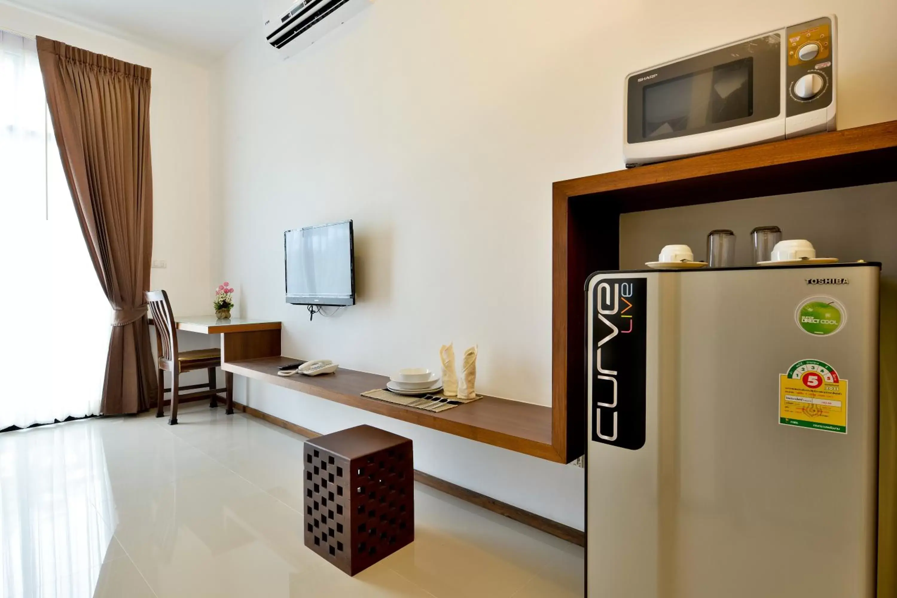 Bedroom, TV/Entertainment Center in The Choice Hotel - Adults Only