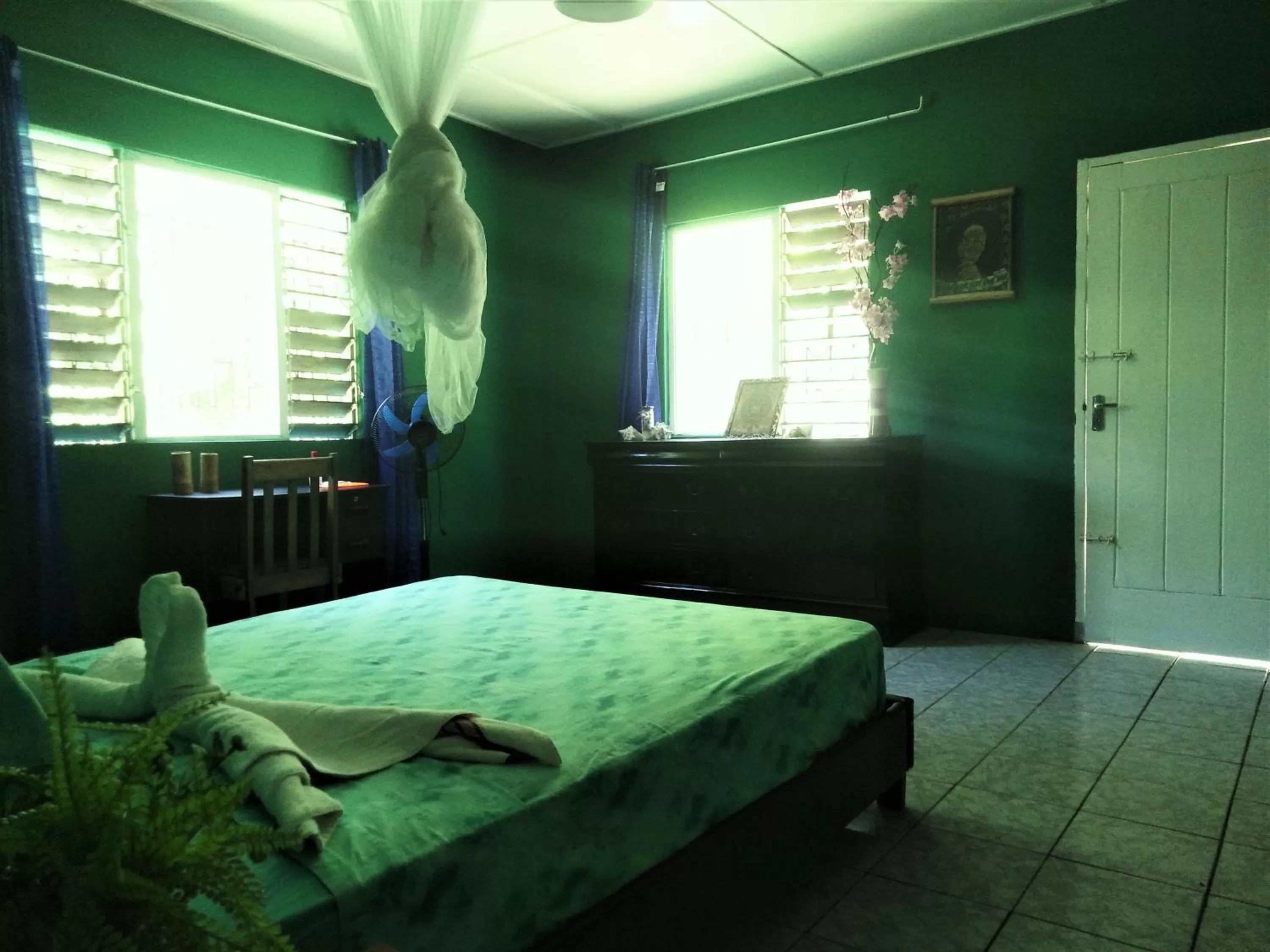 Bed in TOGA GUEST HOUSE