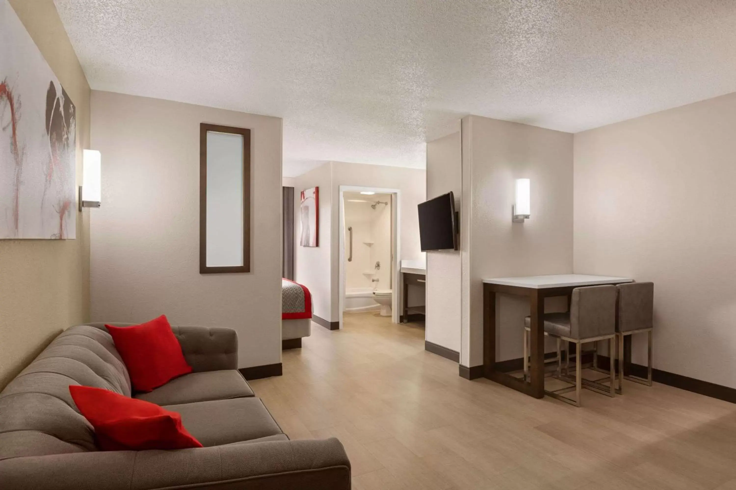 Photo of the whole room, Seating Area in Ramada by Wyndham Suites Orlando Airport