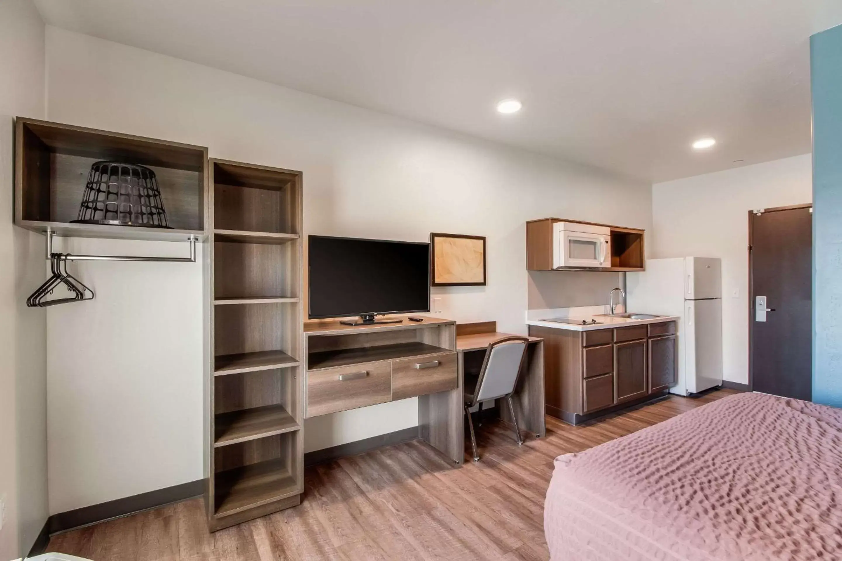 Photo of the whole room, TV/Entertainment Center in WoodSpring Suites Bakersfield Airport