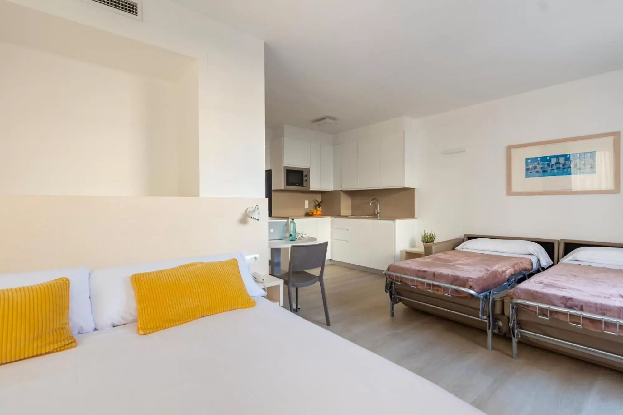 Bed in Atenea Park Suites & Apartments