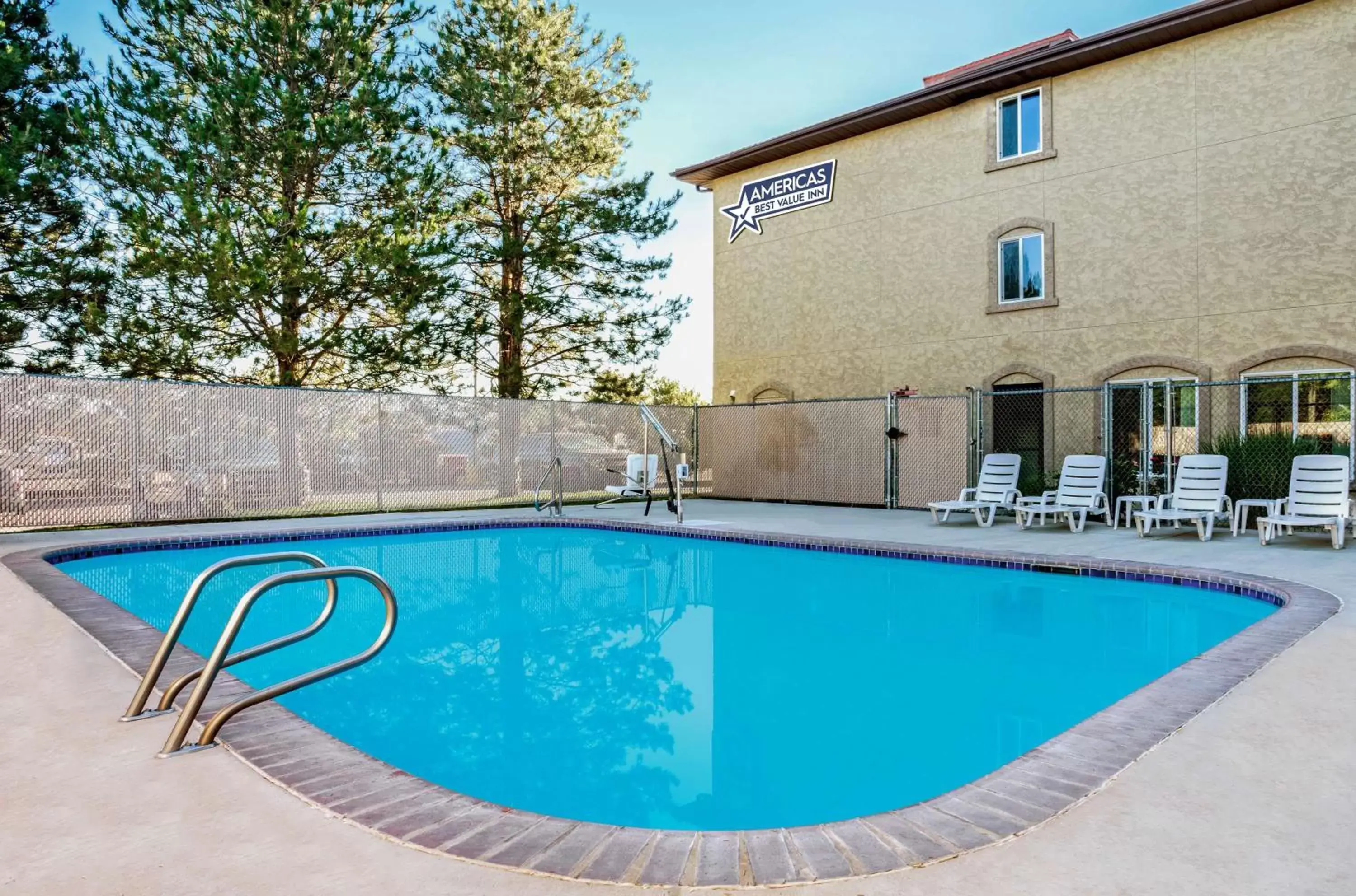 Swimming pool, Property Building in Americas Best Value Inn Sparks