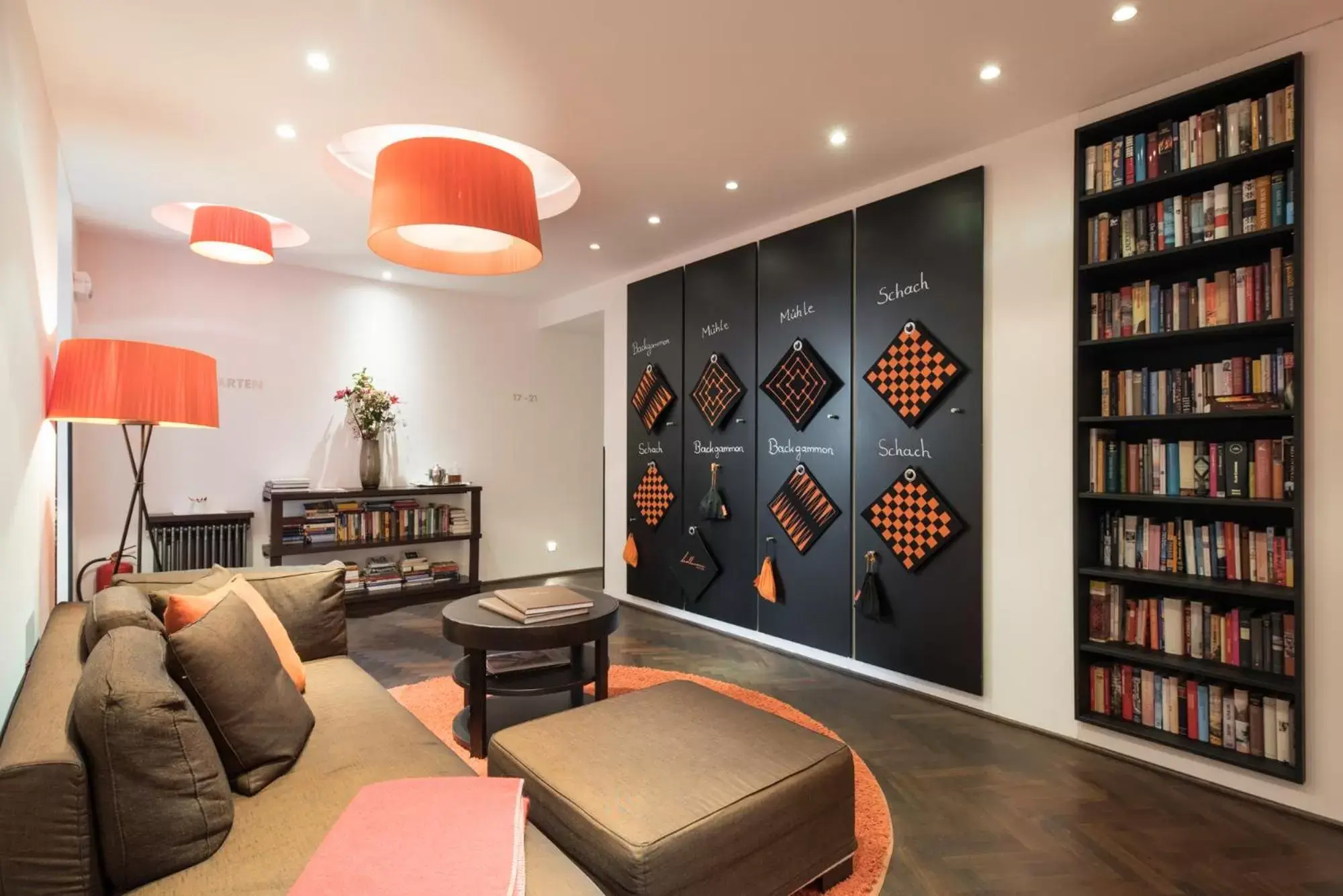 Communal lounge/ TV room, Library in Hollmann Beletage Design & Boutique Hotel