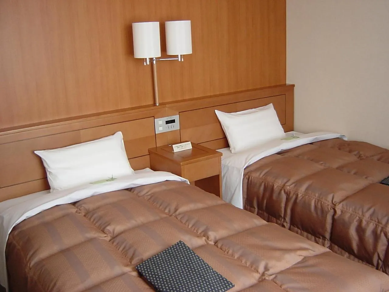 Bed in Hotel Route-Inn Aso Kumamoto Airport Ekimae
