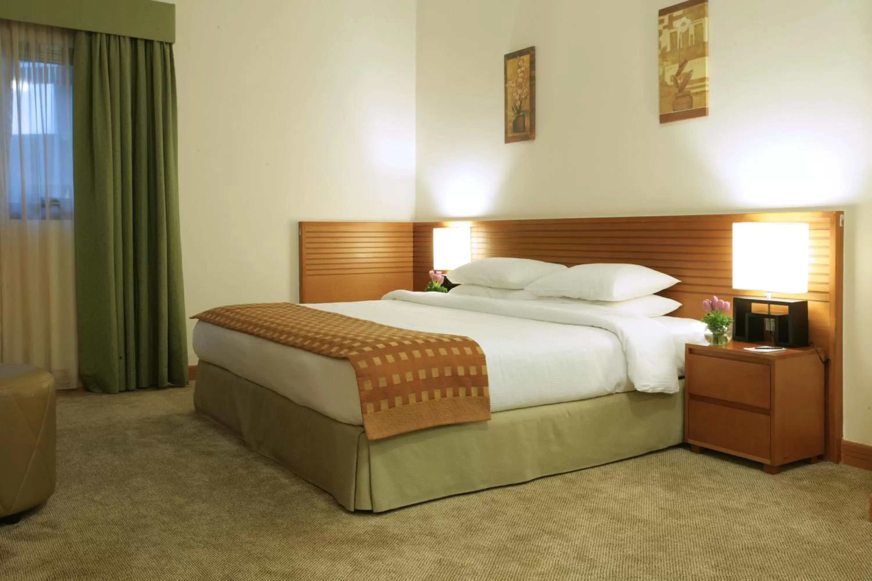 Bed in Ramada Hotel & Suites by Wyndham Ajman