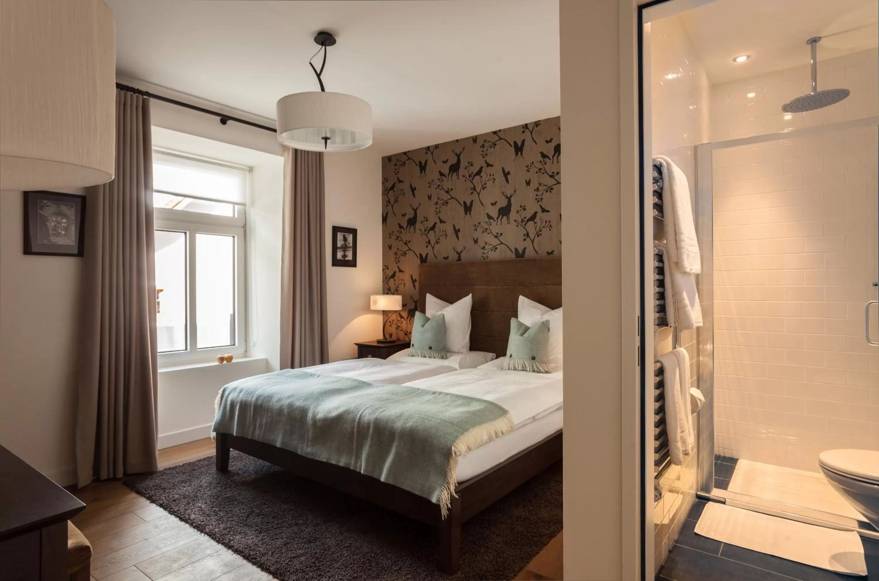 Bed in Boutique-Hotel Garni Bellevue Davos Wiesen