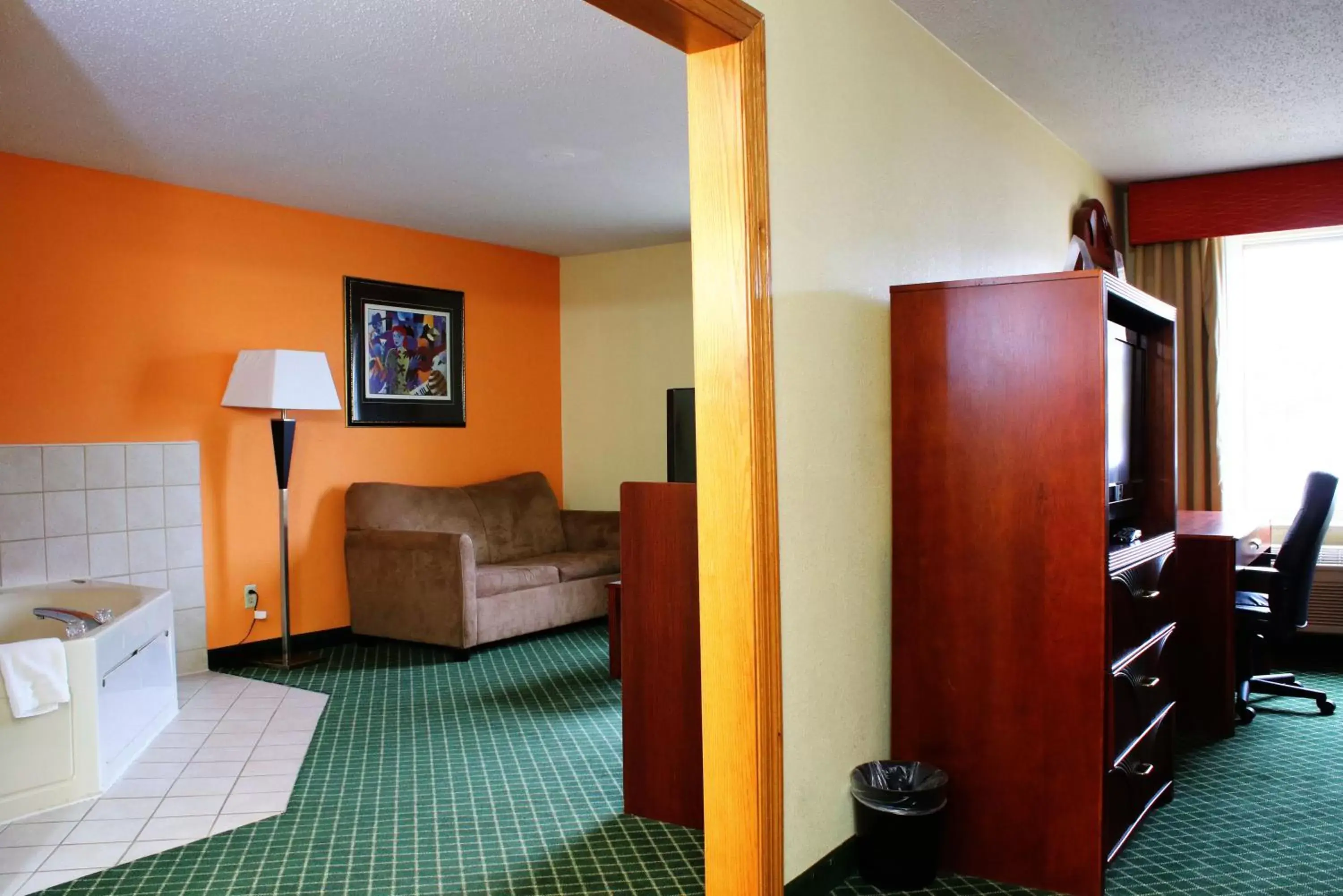 TV/Entertainment Center in Days Inn & Suites by Wyndham Bloomington/Normal IL