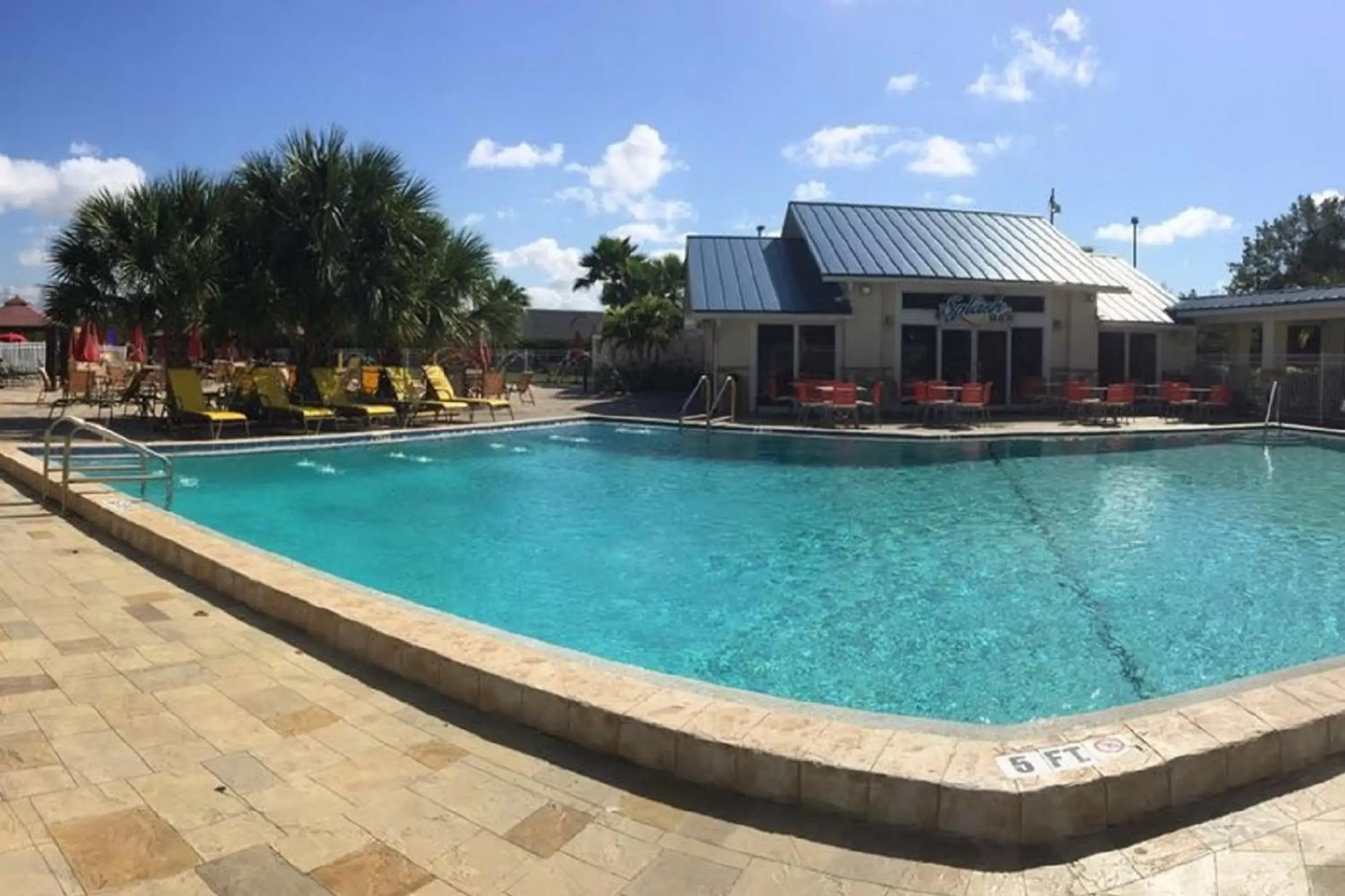 Swimming Pool in SureStay Plus by Best Western Orlando International Drive