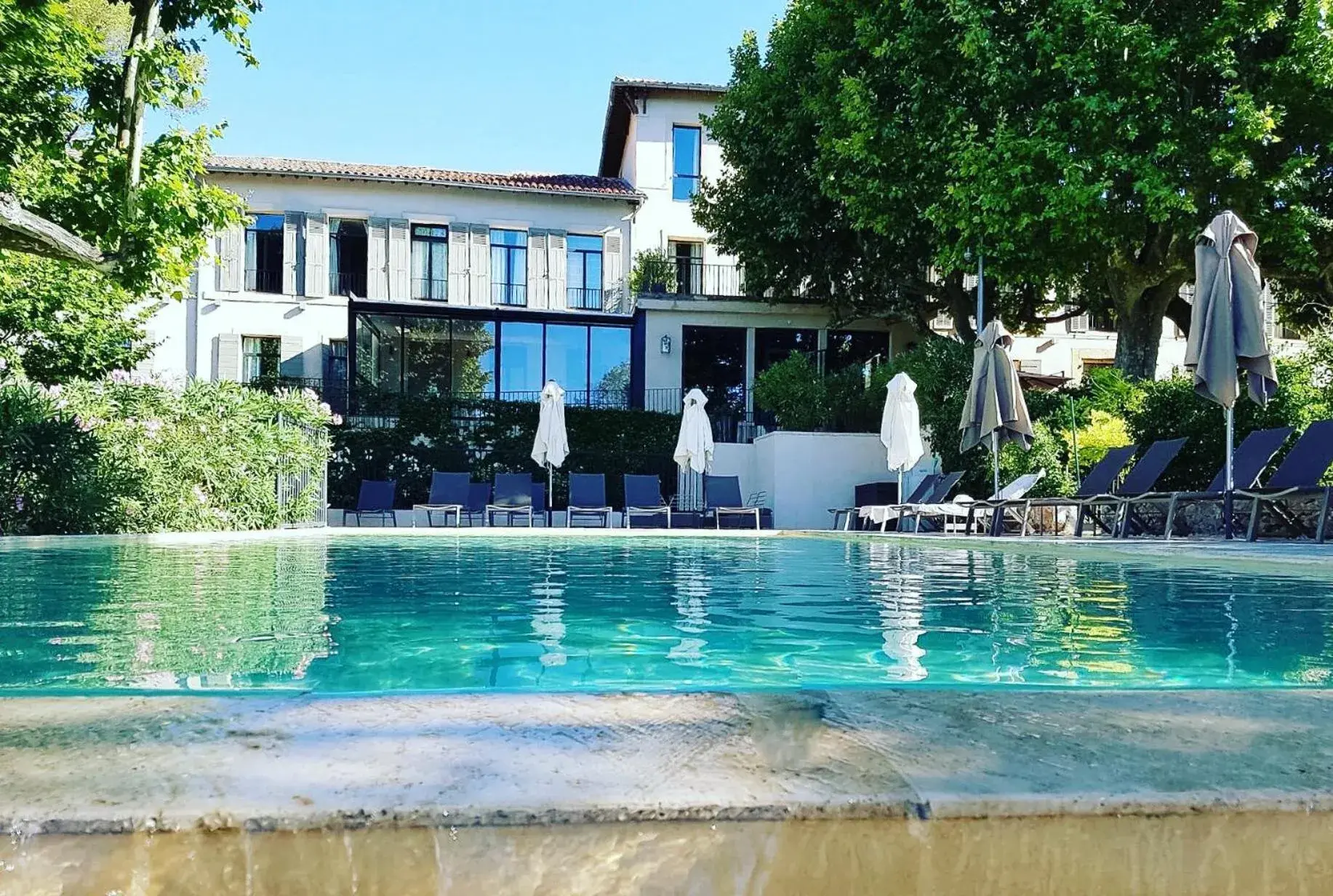 Property building, Swimming Pool in Les Lodges Sainte-Victoire Hotel & Spa