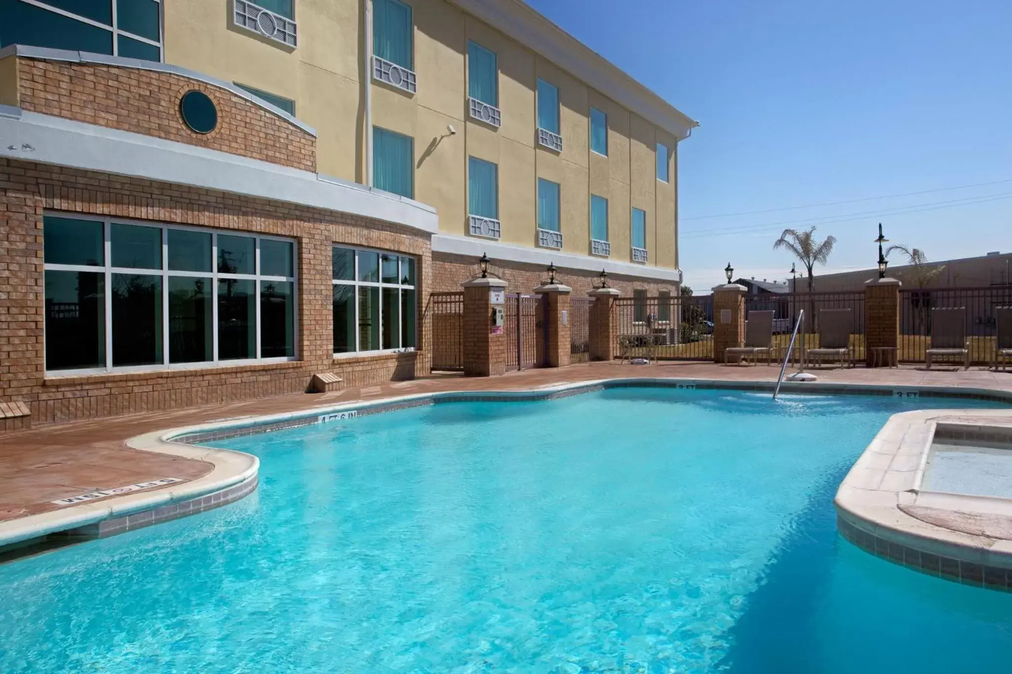 Swimming pool, Property Building in Holiday Inn Express Pearland, an IHG Hotel