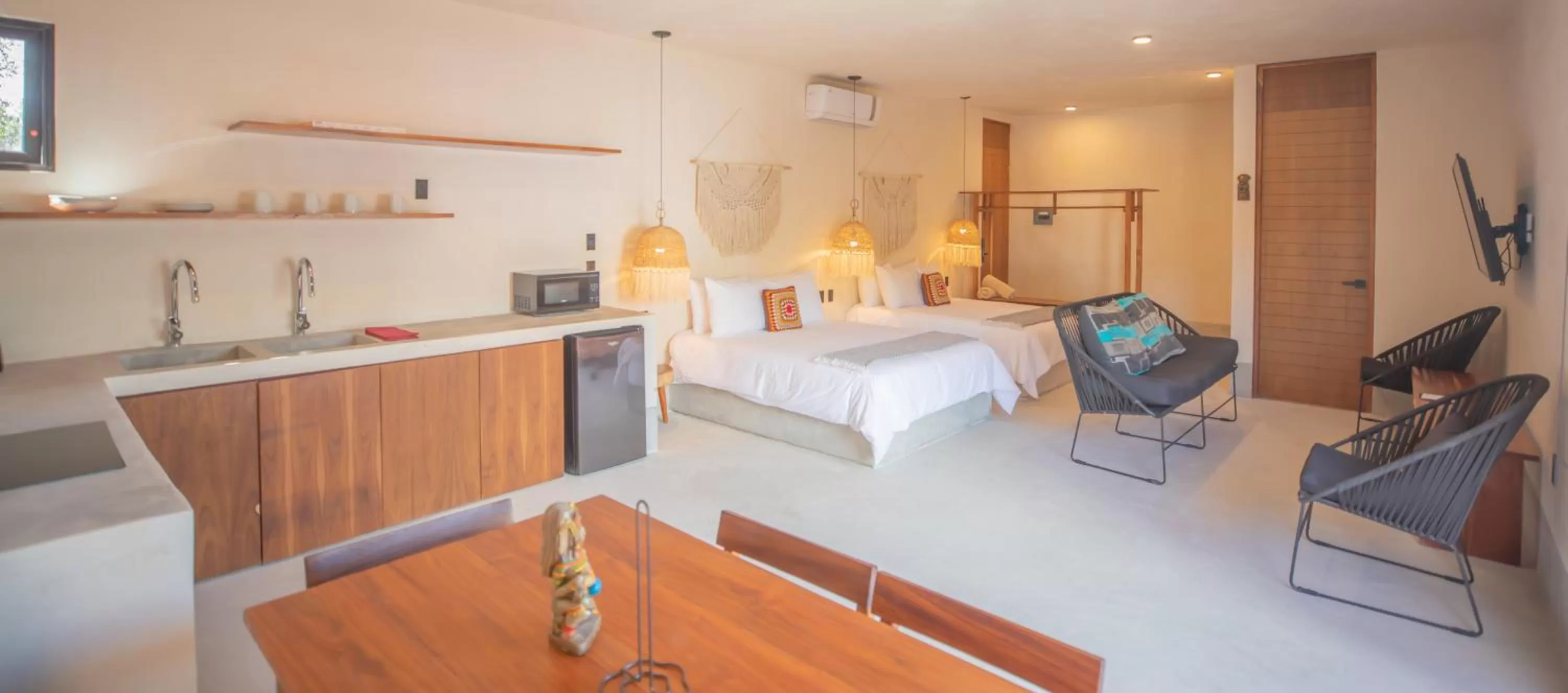 Photo of the whole room, Bed in Nuee Hotel & Beach Club