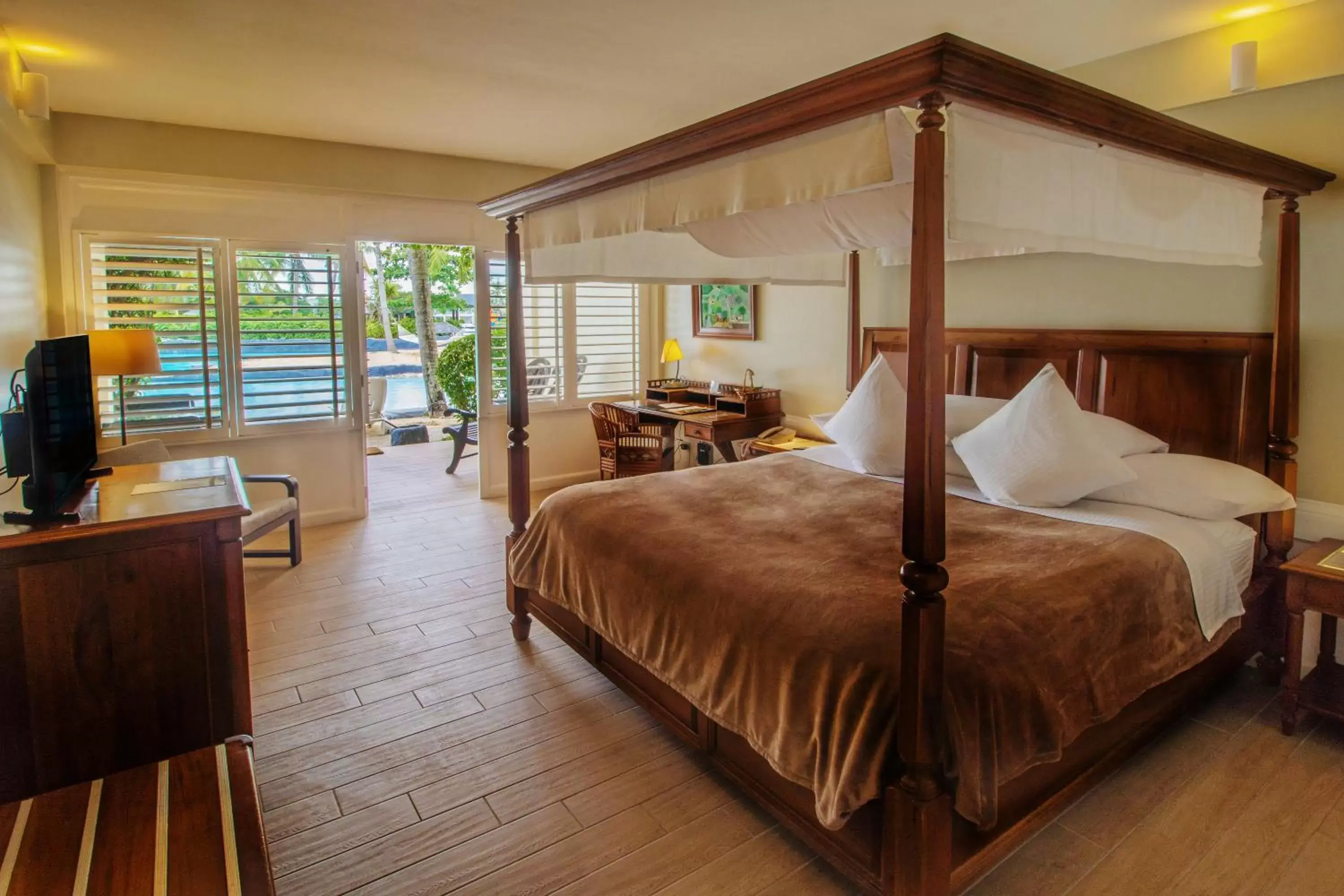 Bed in Plantation Bay Resort and Spa