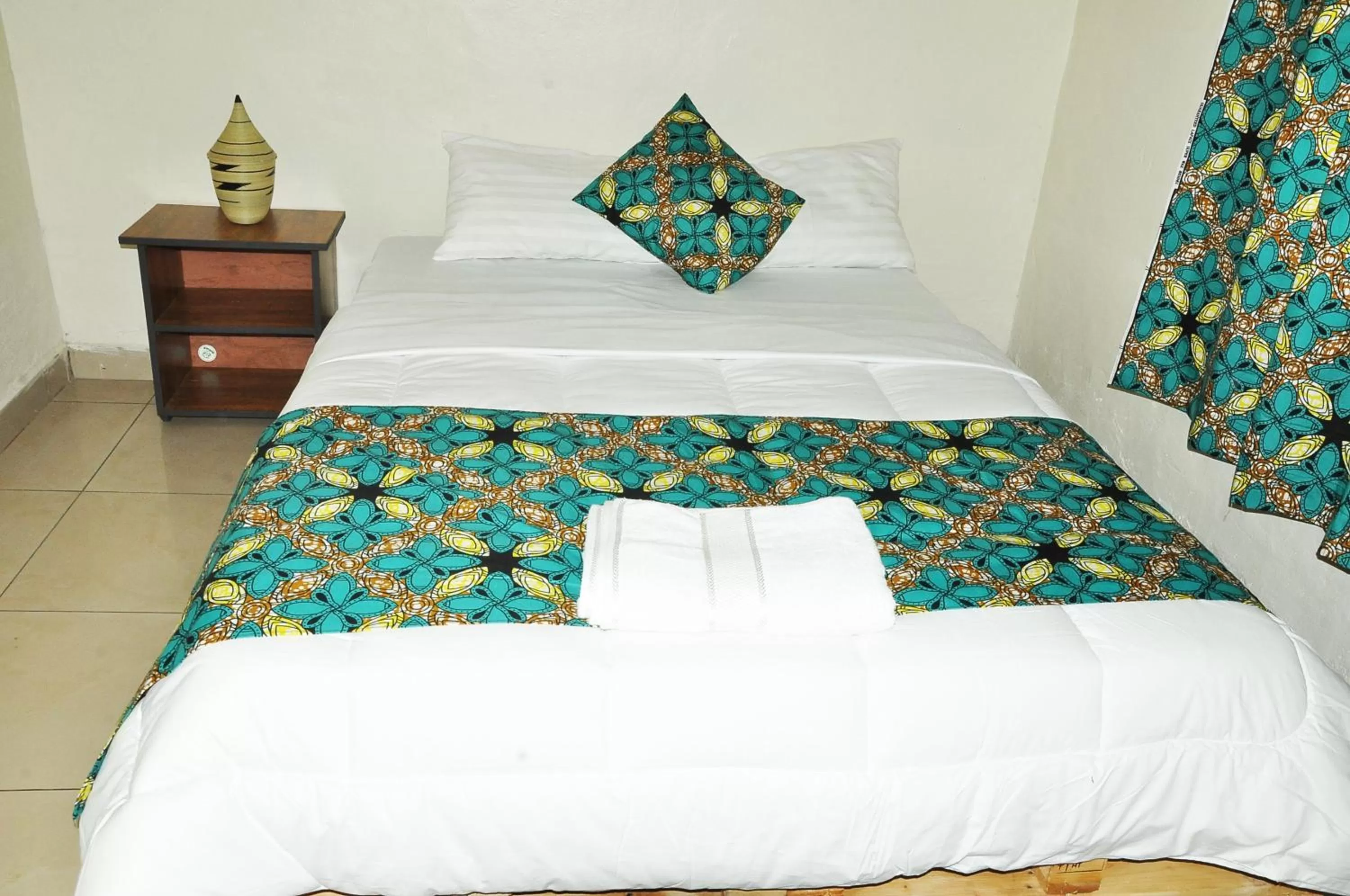 Bed in INZOZI AFRICA HOUSE B&B- Kacyiru