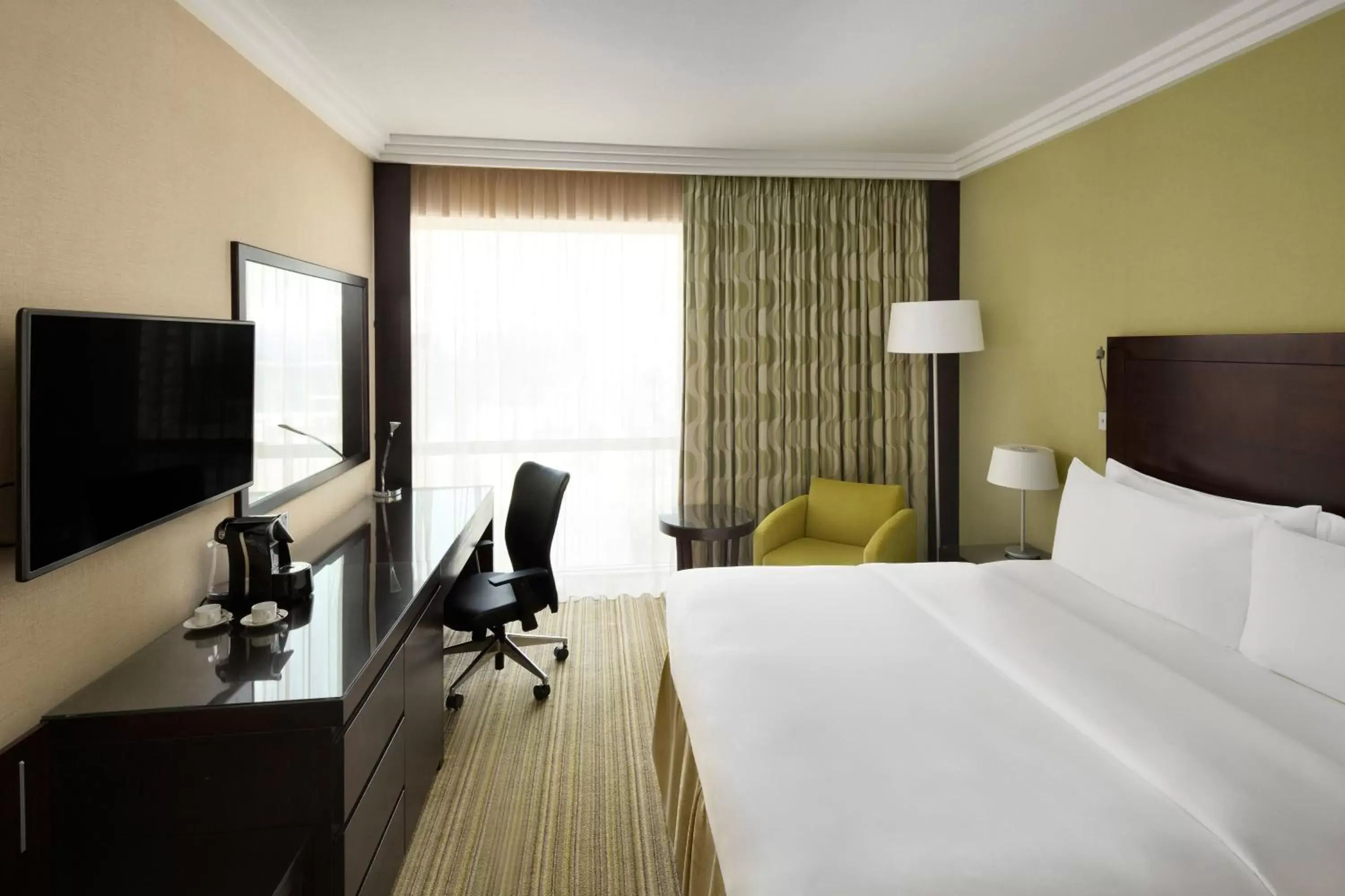 Bed in Crowne Plaza Jeddah, an IHG Hotel
