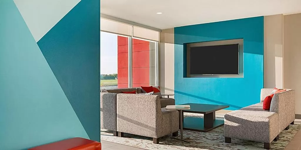Communal lounge/ TV room in avid hotel Fayetteville West by IHG