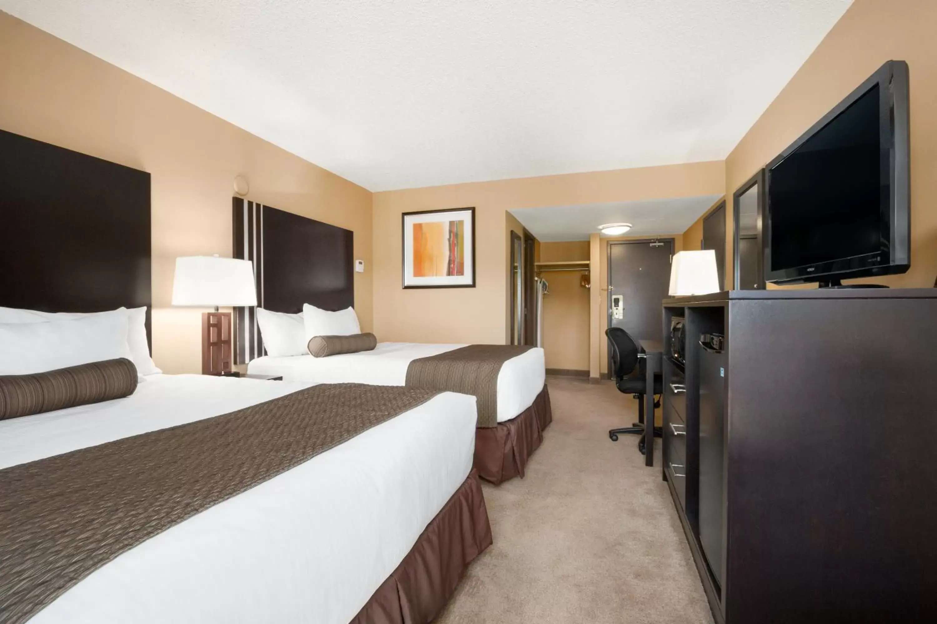 Photo of the whole room, TV/Entertainment Center in Days Inn by Wyndham Calgary Northwest