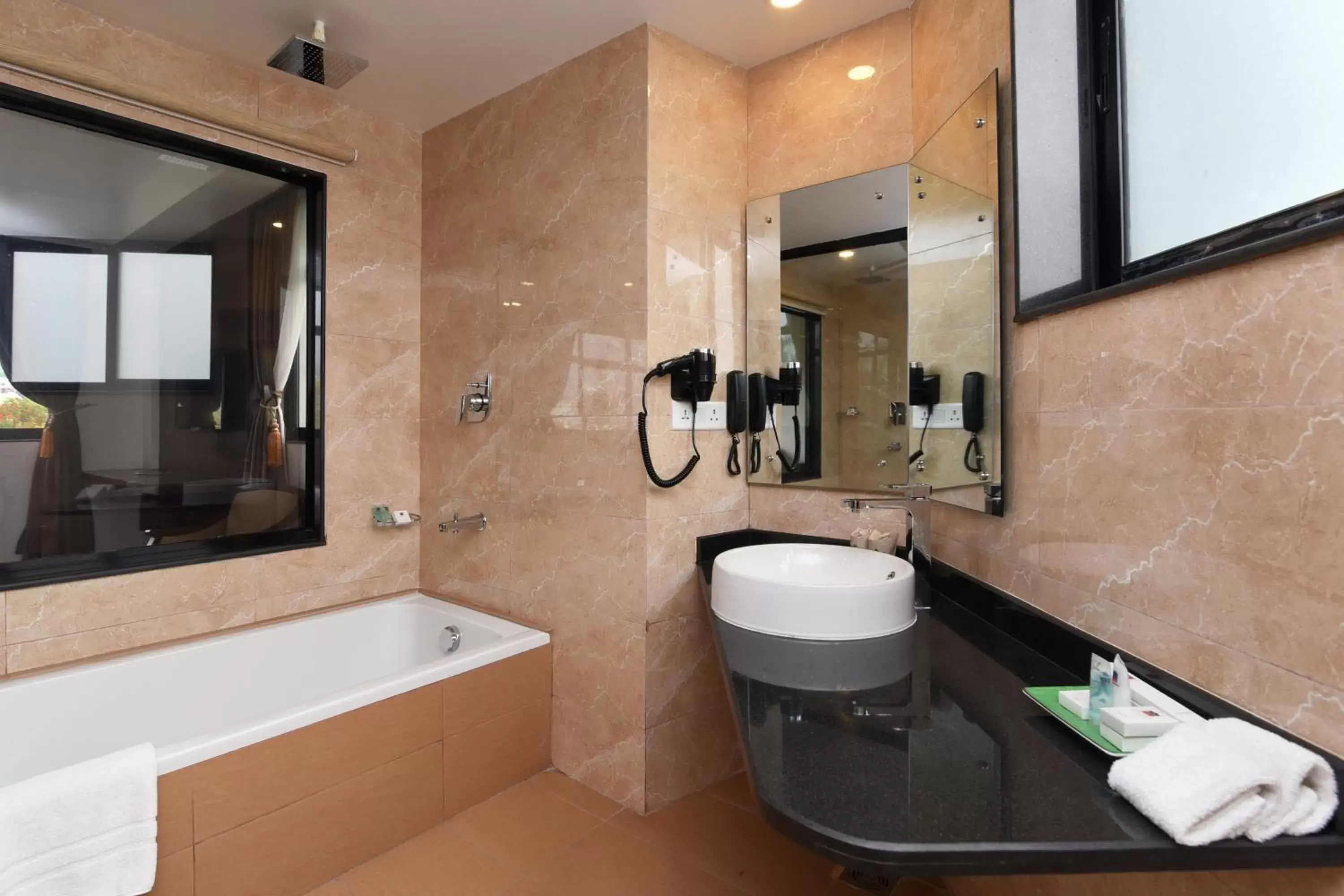 Bathroom in Park Village Resort by KGH Group