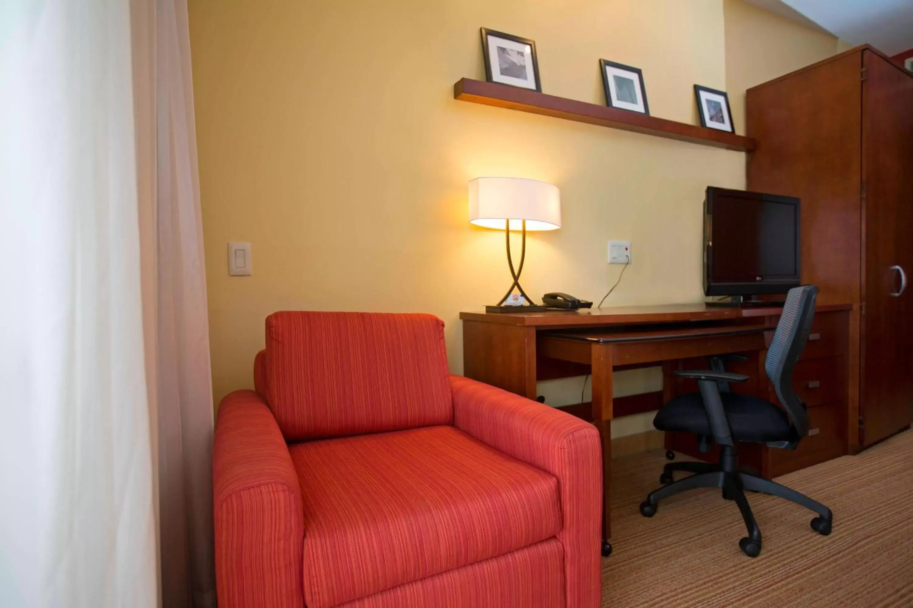 Photo of the whole room, TV/Entertainment Center in Courtyard by Marriott Paramaribo