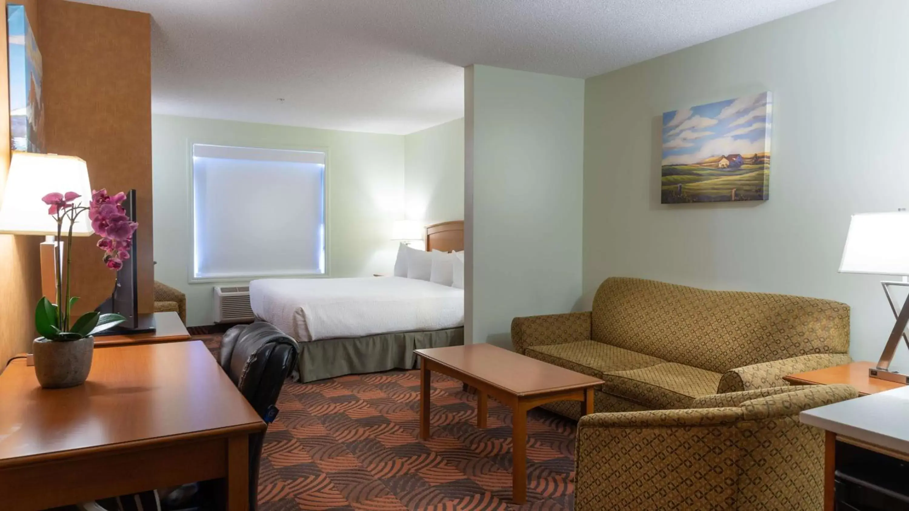 Bedroom in SureStay Plus by Best Western Calgary South East