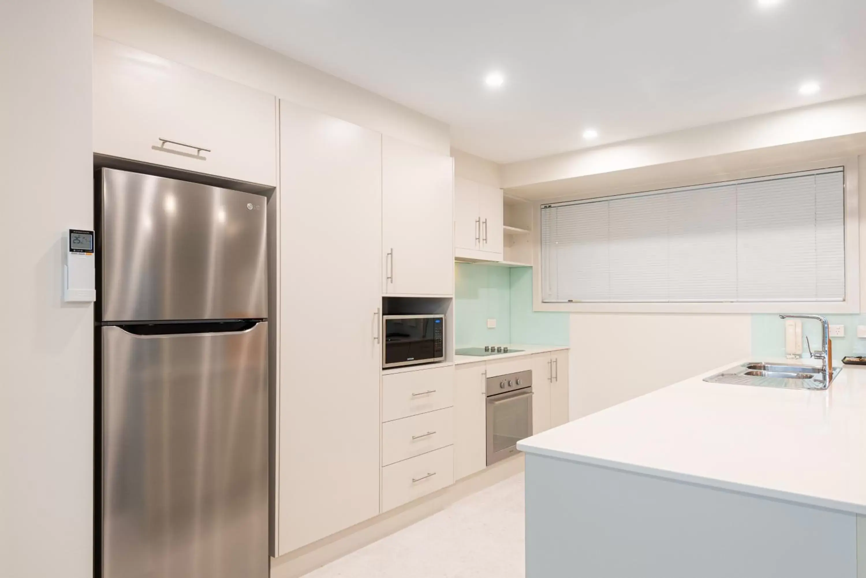 Kitchen/Kitchenette in Warners Bay Apartments