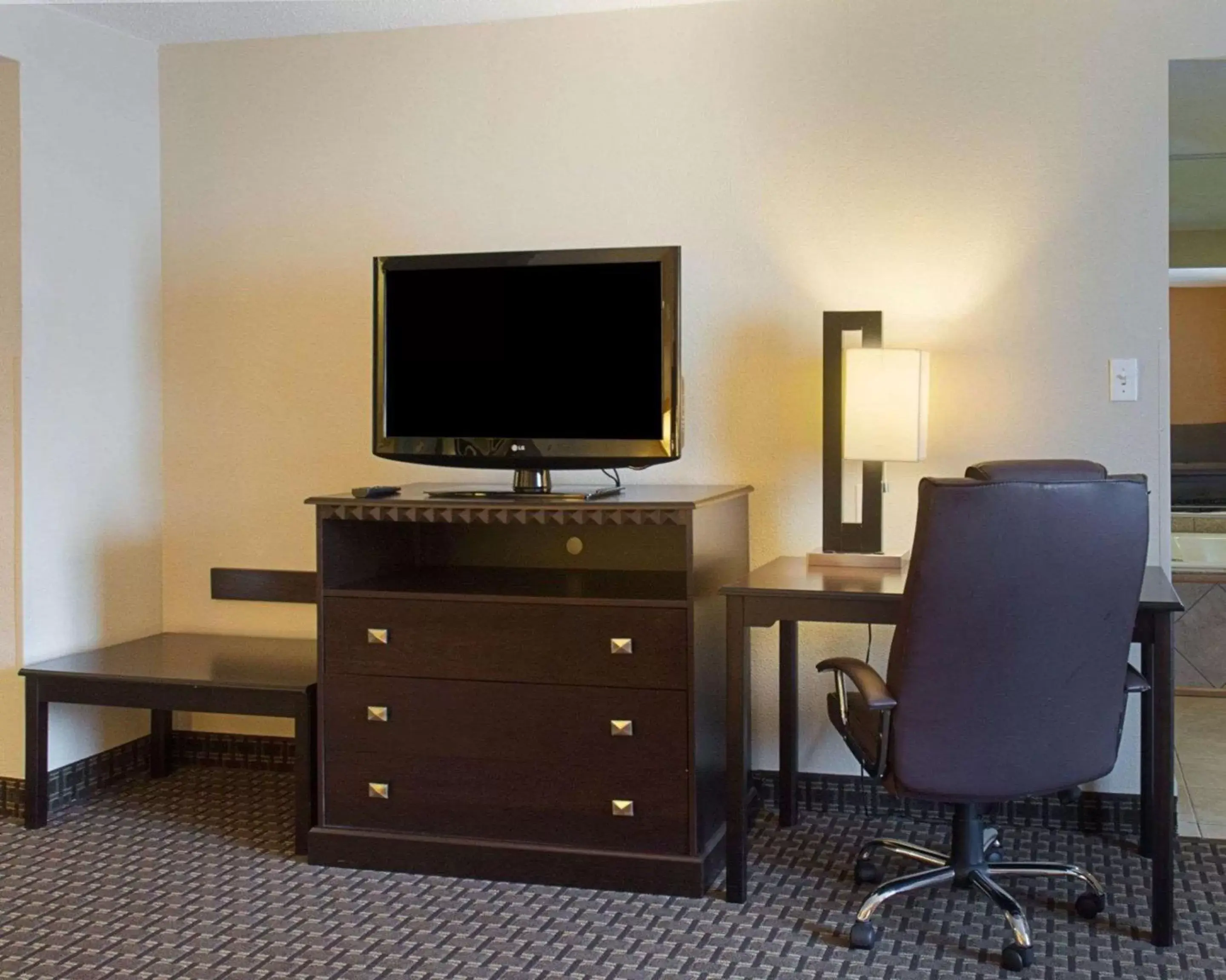 Photo of the whole room, TV/Entertainment Center in Quality Inn & Suites