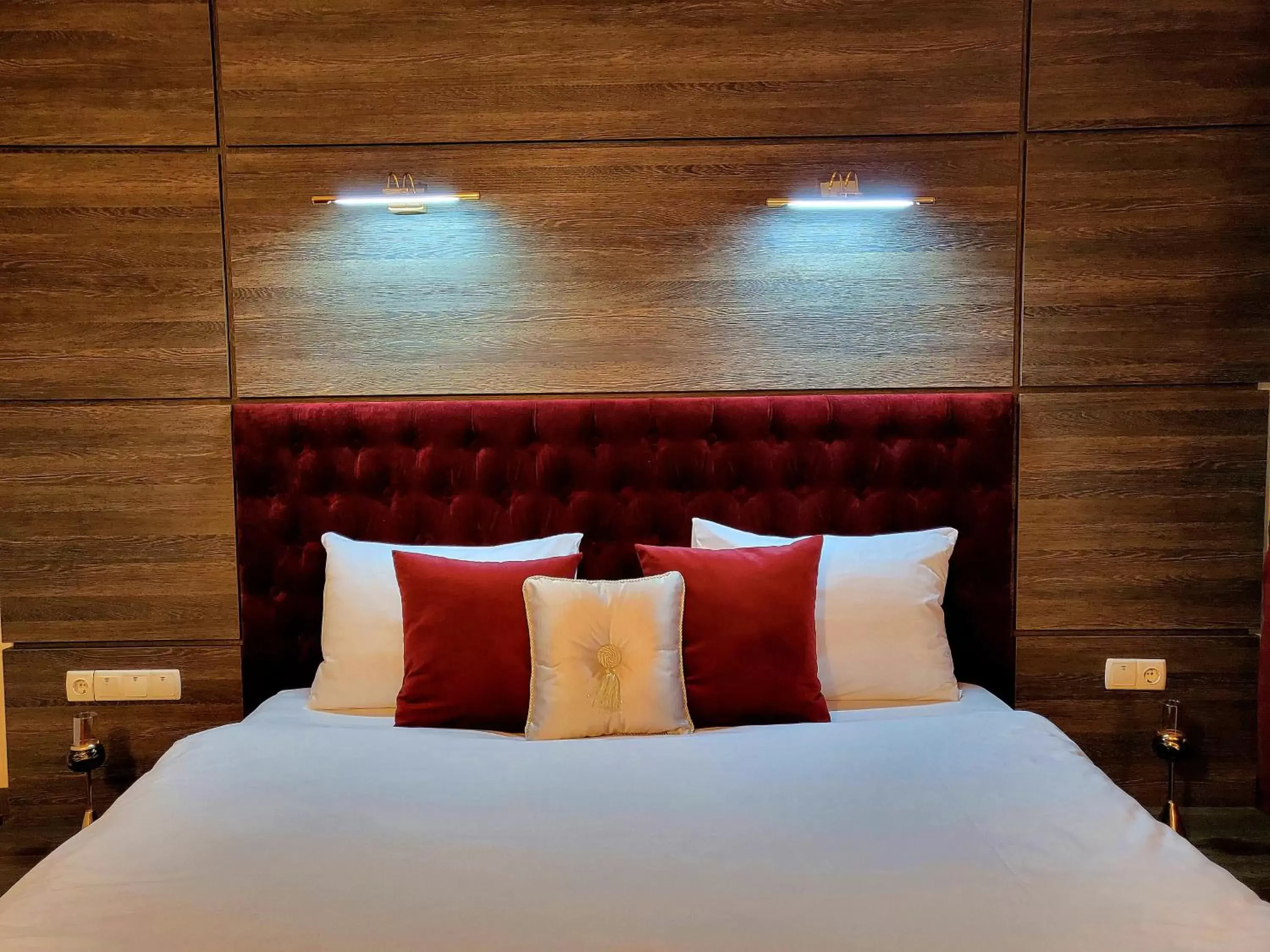 Bed in Maxim Pasha Hotel