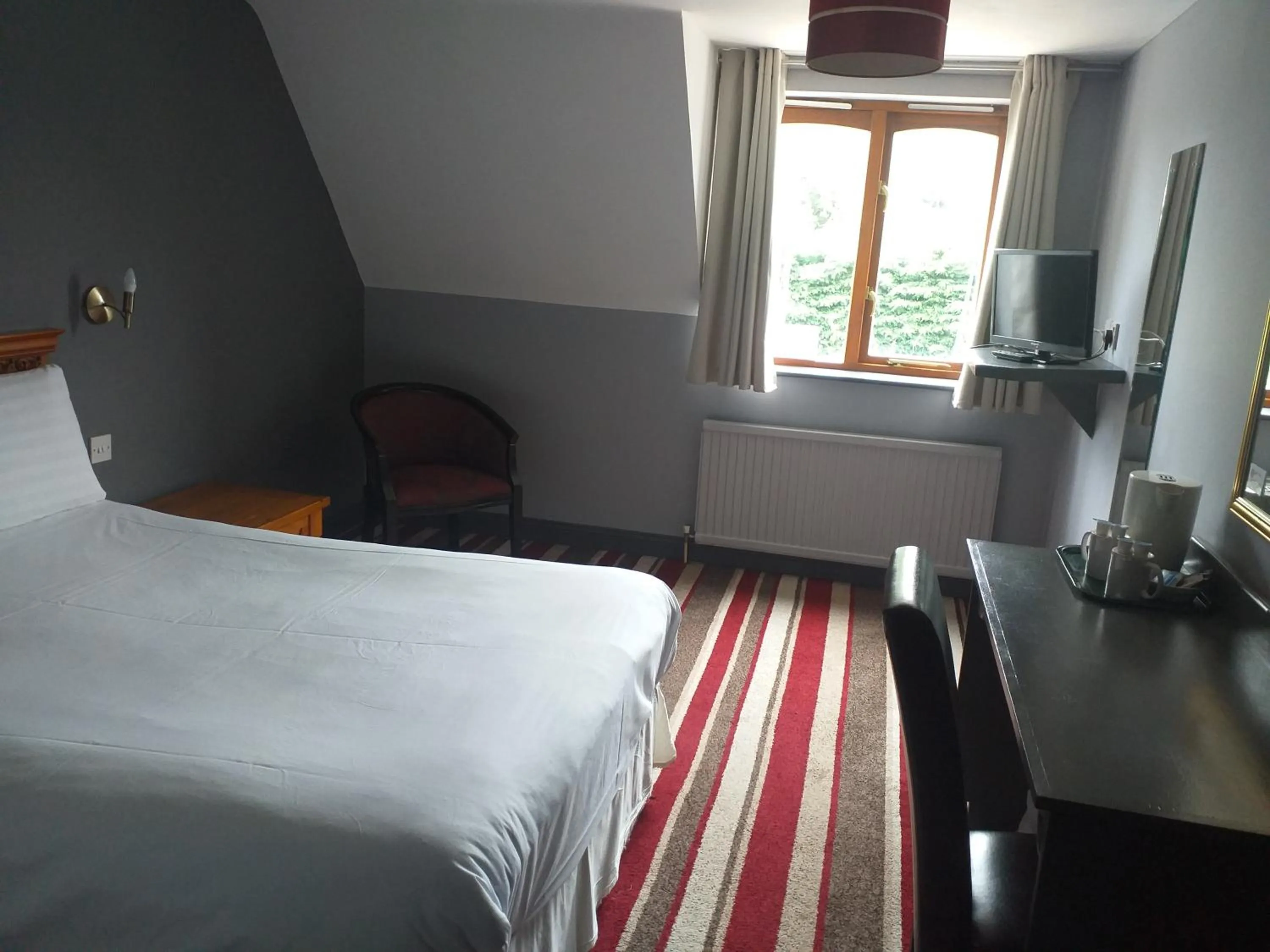 Bed in The Airman Hotel