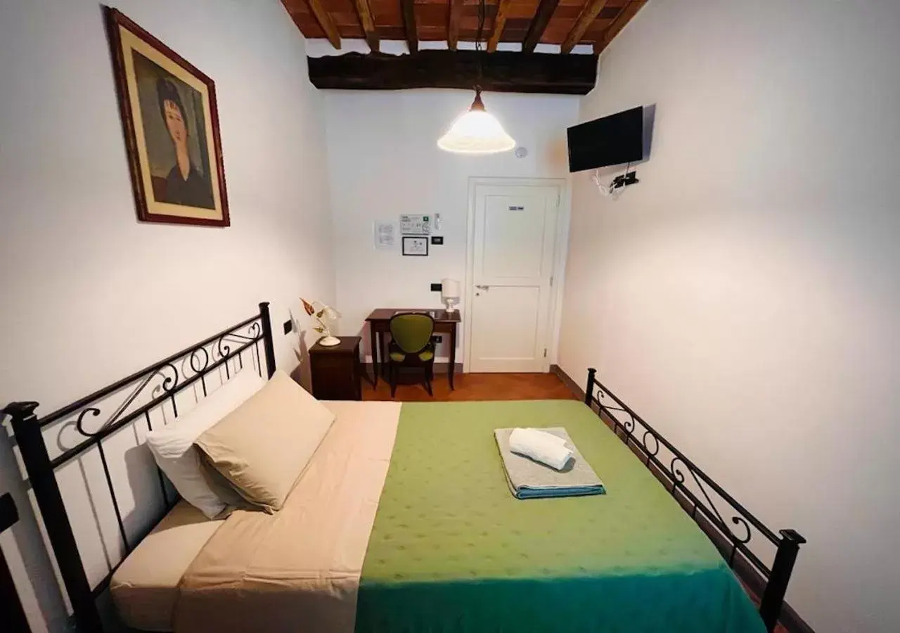 Photo of the whole room, Bed in B&B Giardino delle Camelie