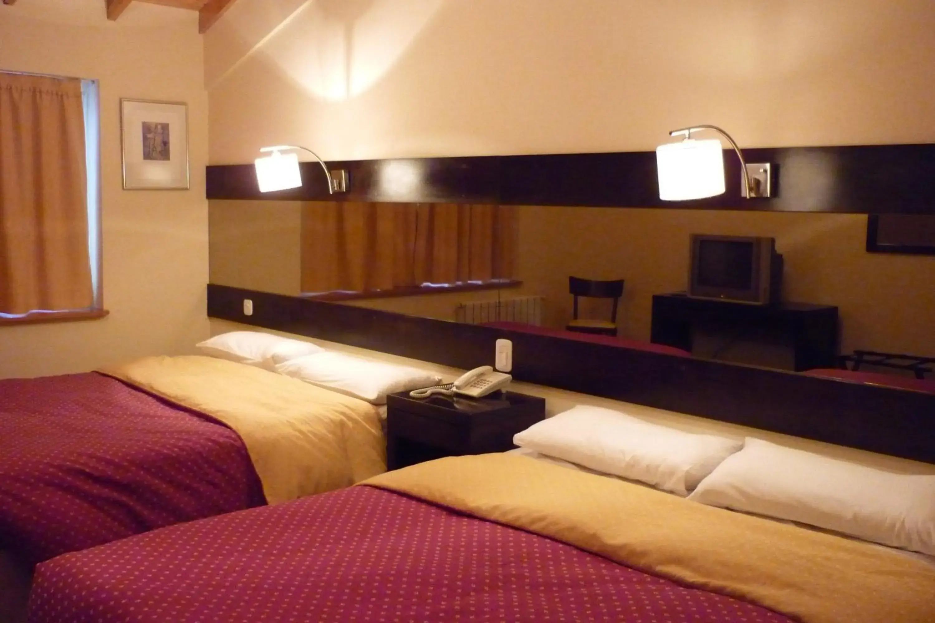 Bed in Marcopolo Suites Calafate