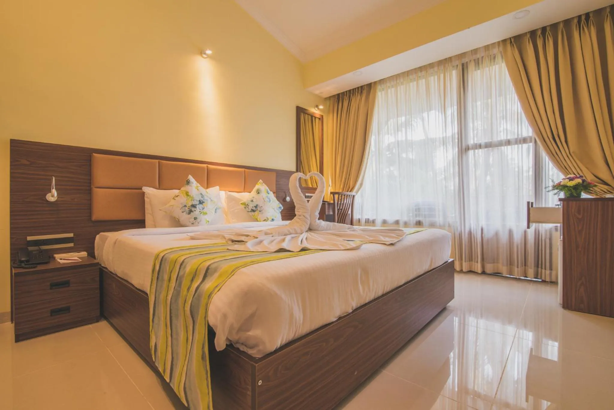 Photo of the whole room, Bed in Clarion Hotel Ocean Palms Goa