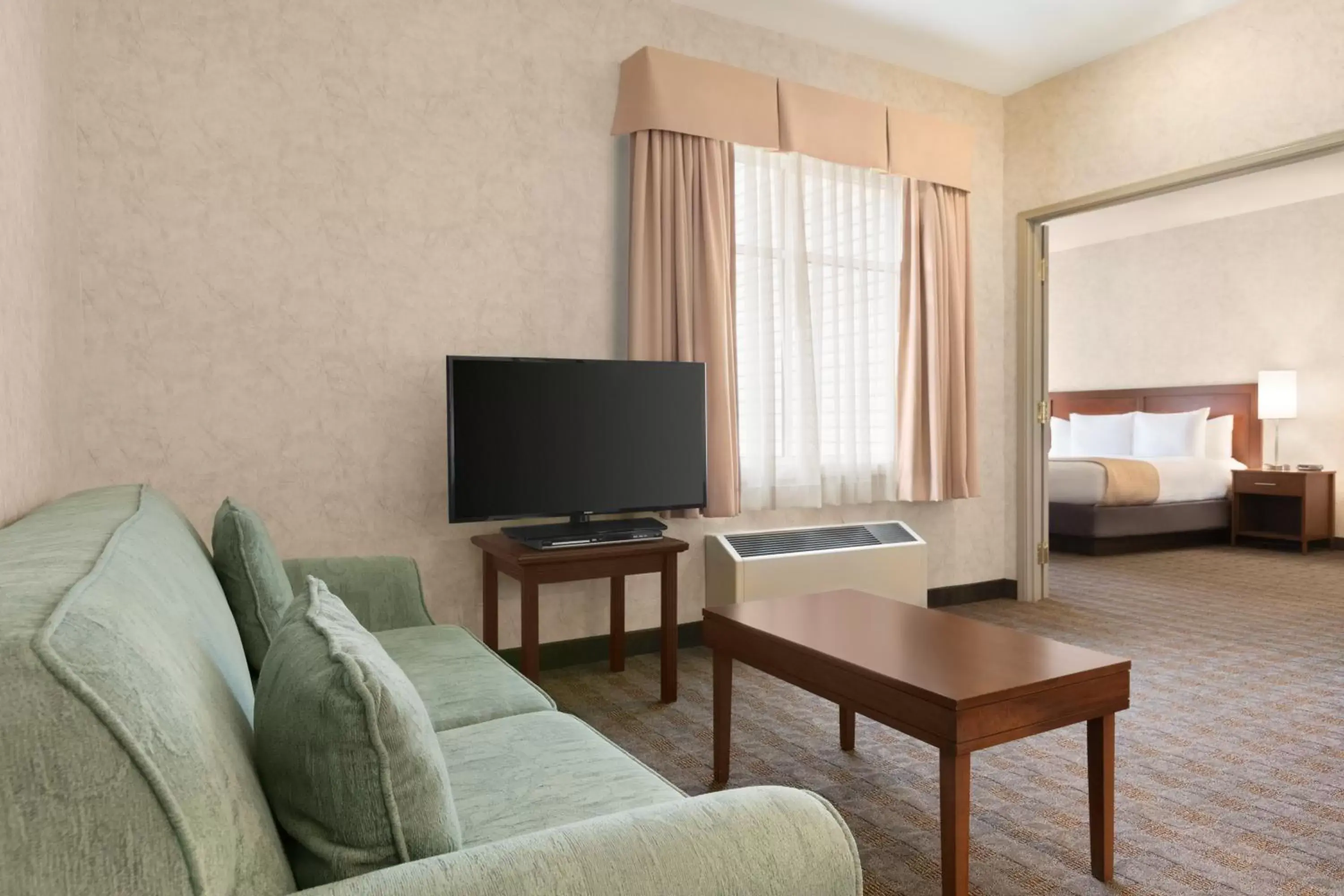 Bedroom, Seating Area in Days Inn by Wyndham Ottawa Airport