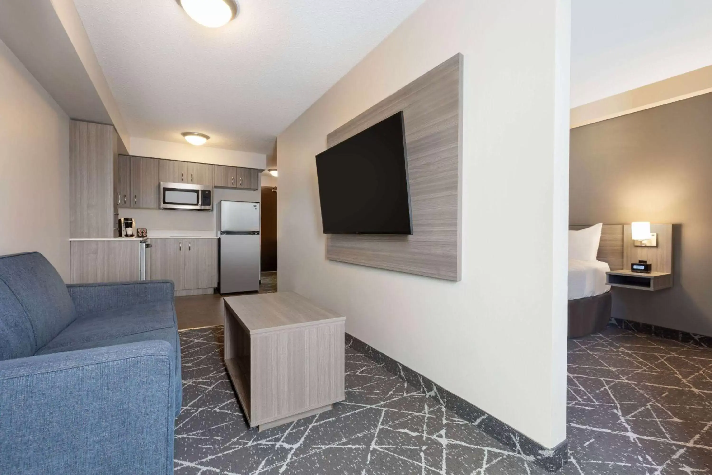 Bed, TV/Entertainment Center in Microtel Inn & Suites by Wyndham Lloydminster