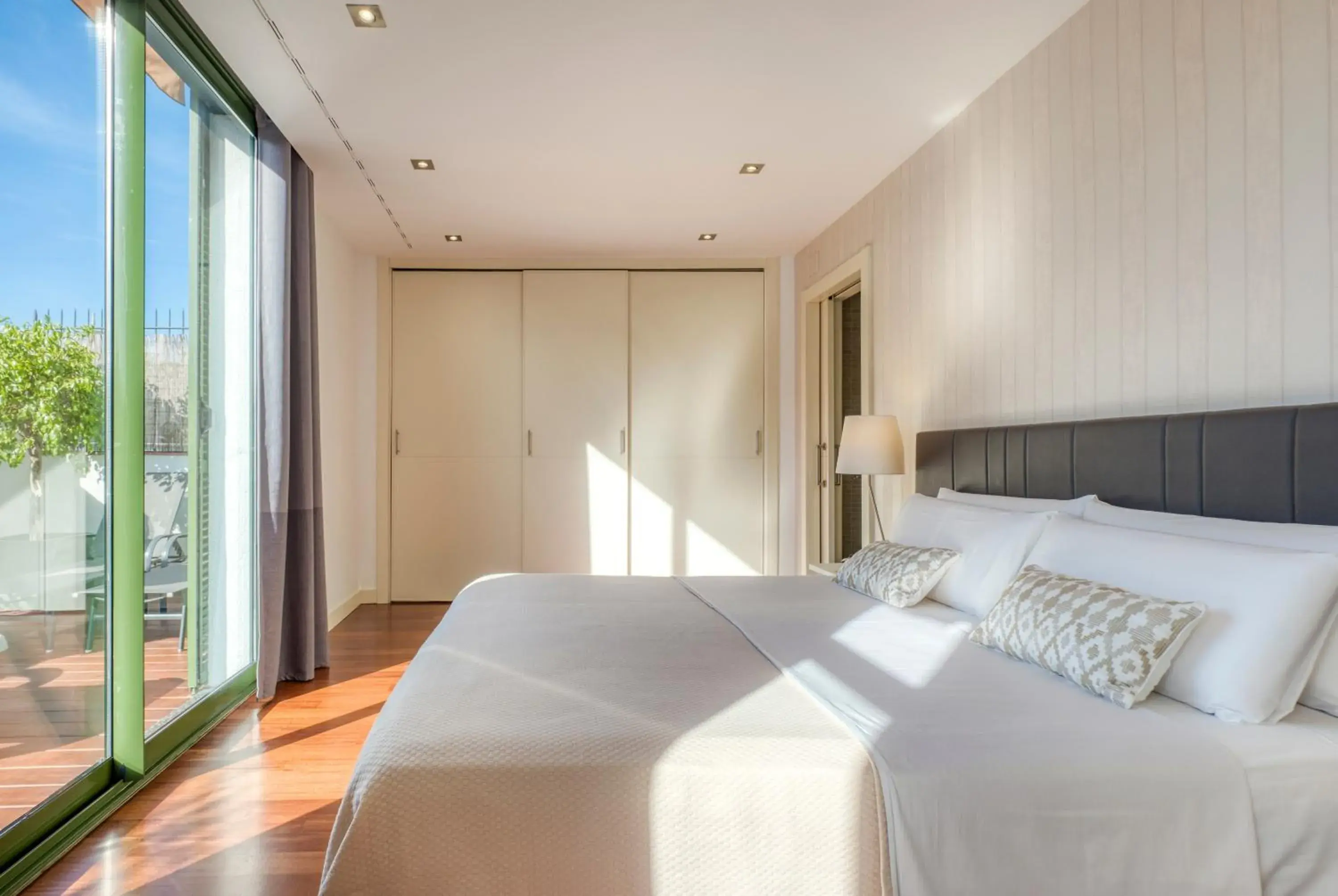 Bed in Paseo de Gracia Bas Apartments by Aspasios