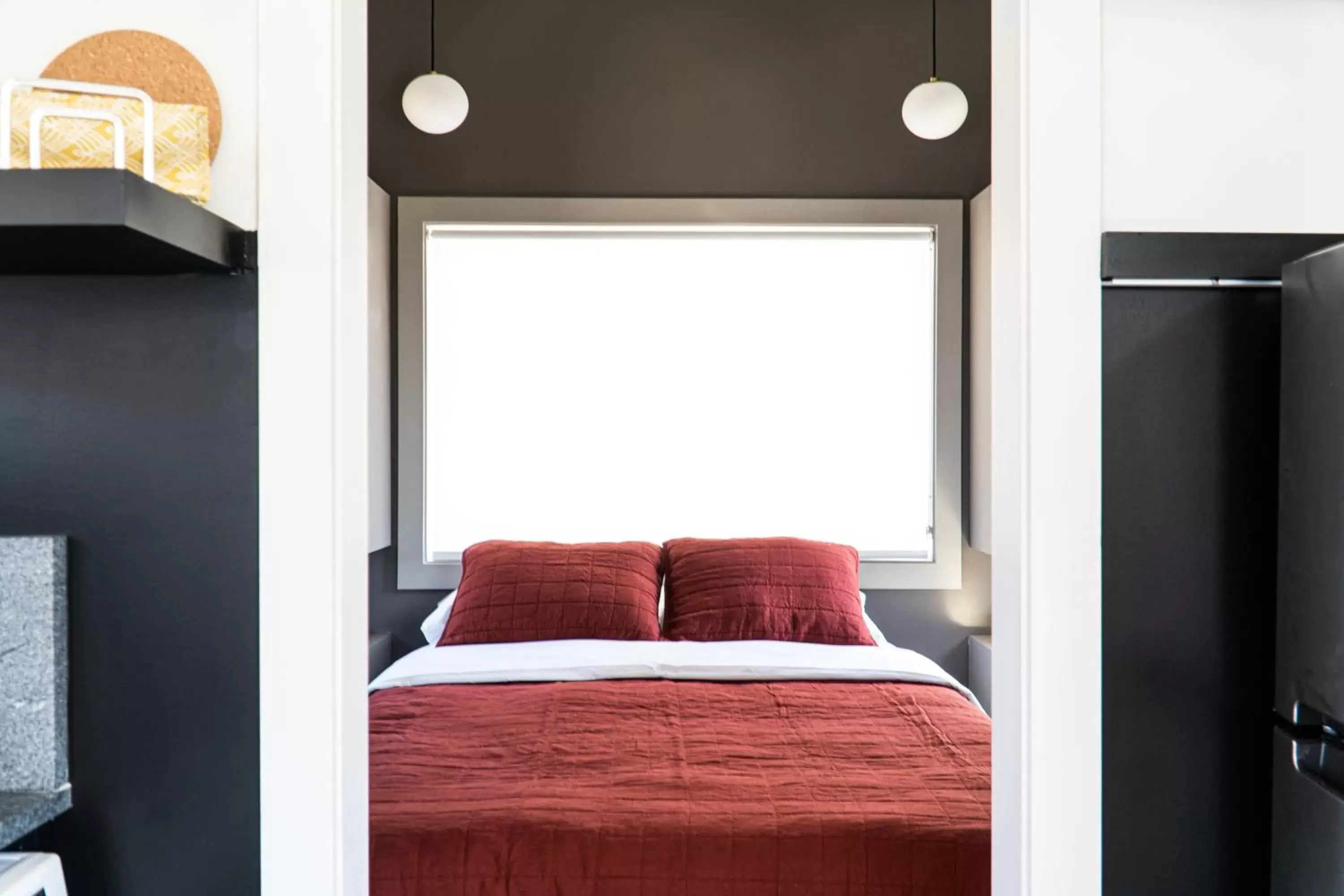 Bed in Ironwood Grove, Tiny House Hotel