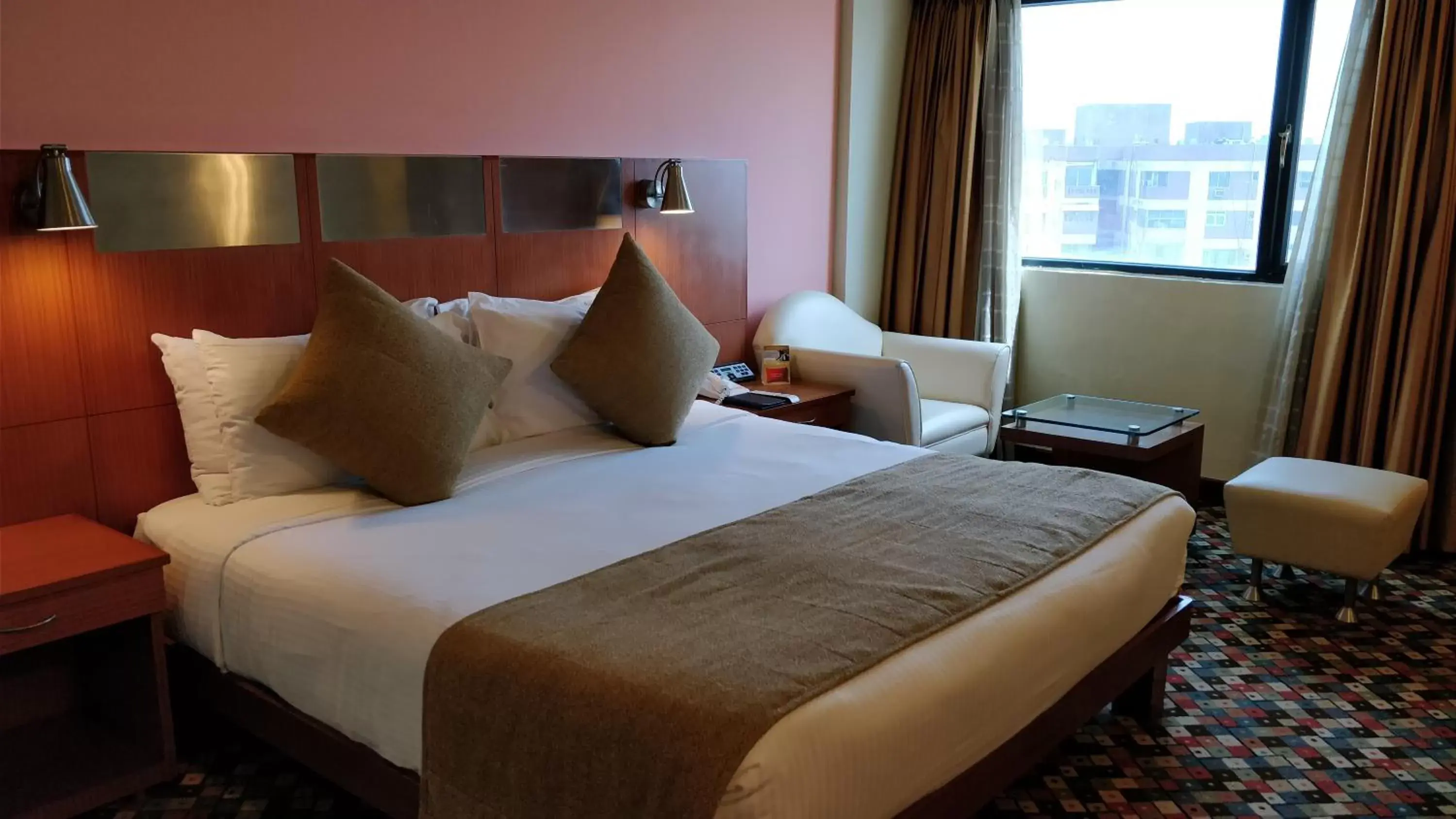 Bed in The Suryaa Hotel New Delhi