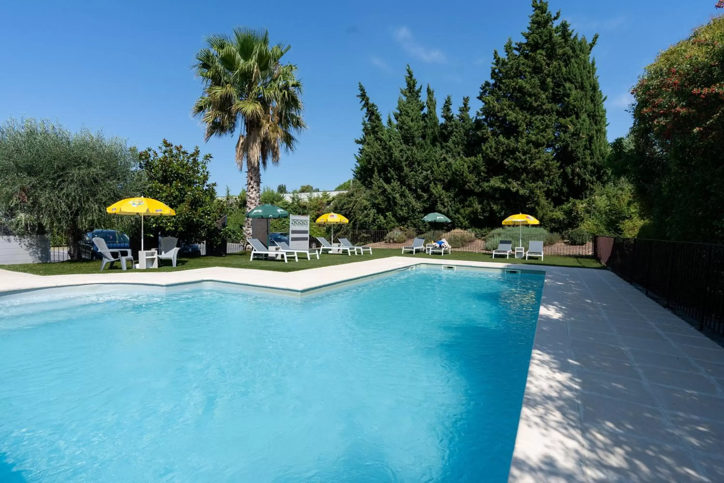 Swimming Pool in Brit Hotel Avignon Sud Le Calendal