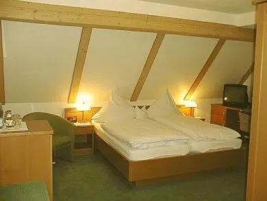 Bed in Land-gut-Hotel Räuber Lippoldskrug