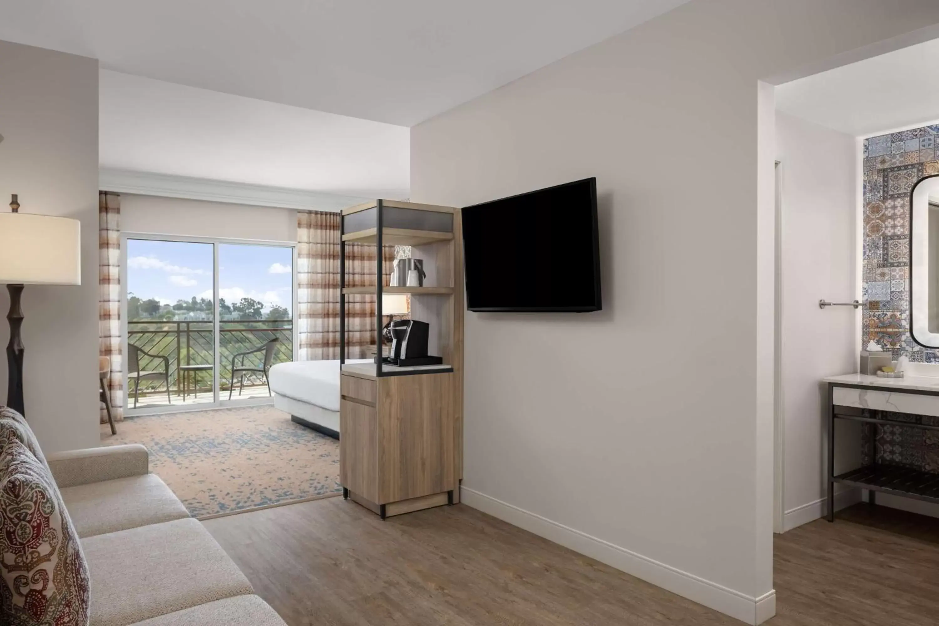 Living room, TV/Entertainment Center in The Cassara Carlsbad, Tapestry Collection By Hilton
