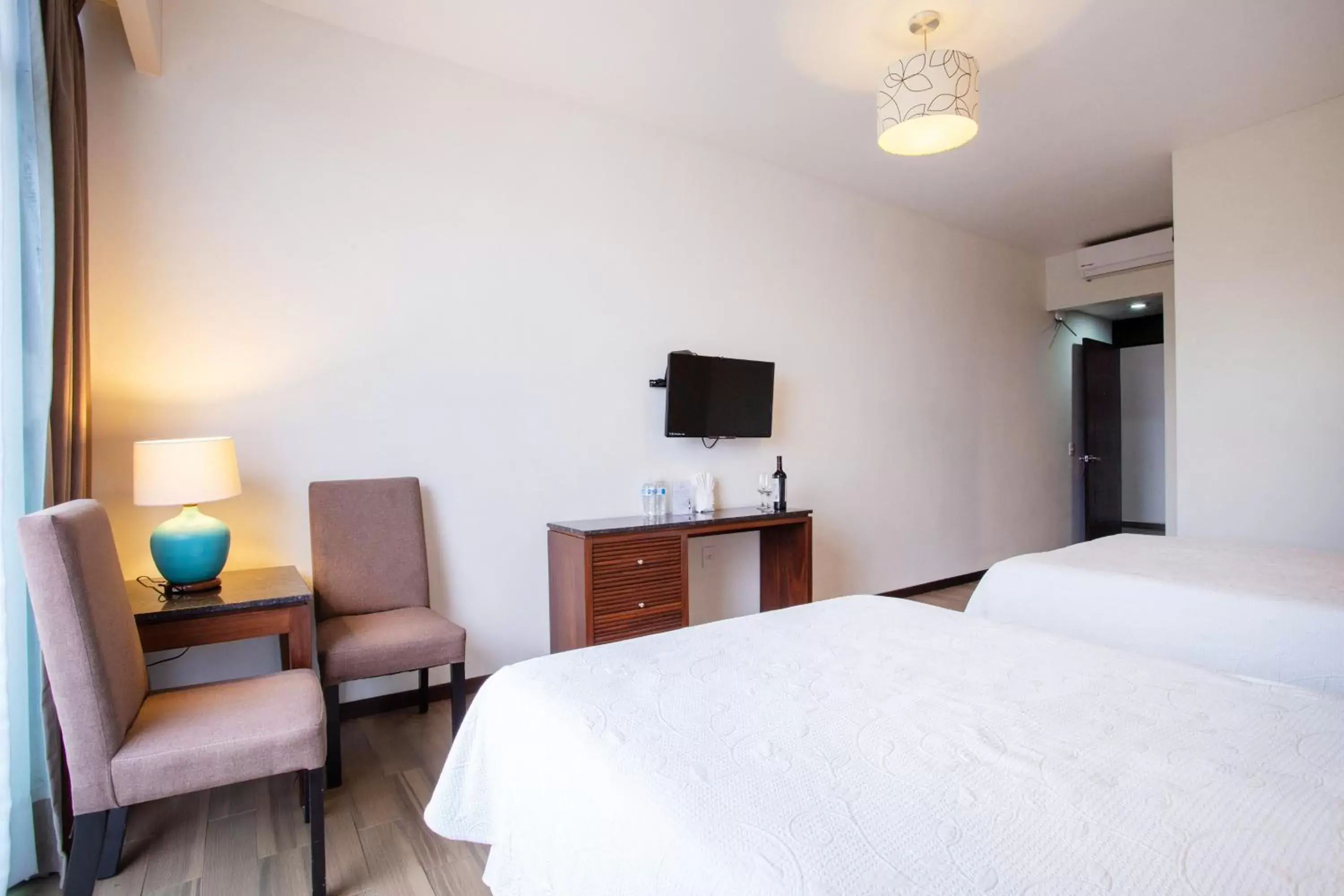 Bed in BLAZE Hotel & Suites Puerto Vallarta