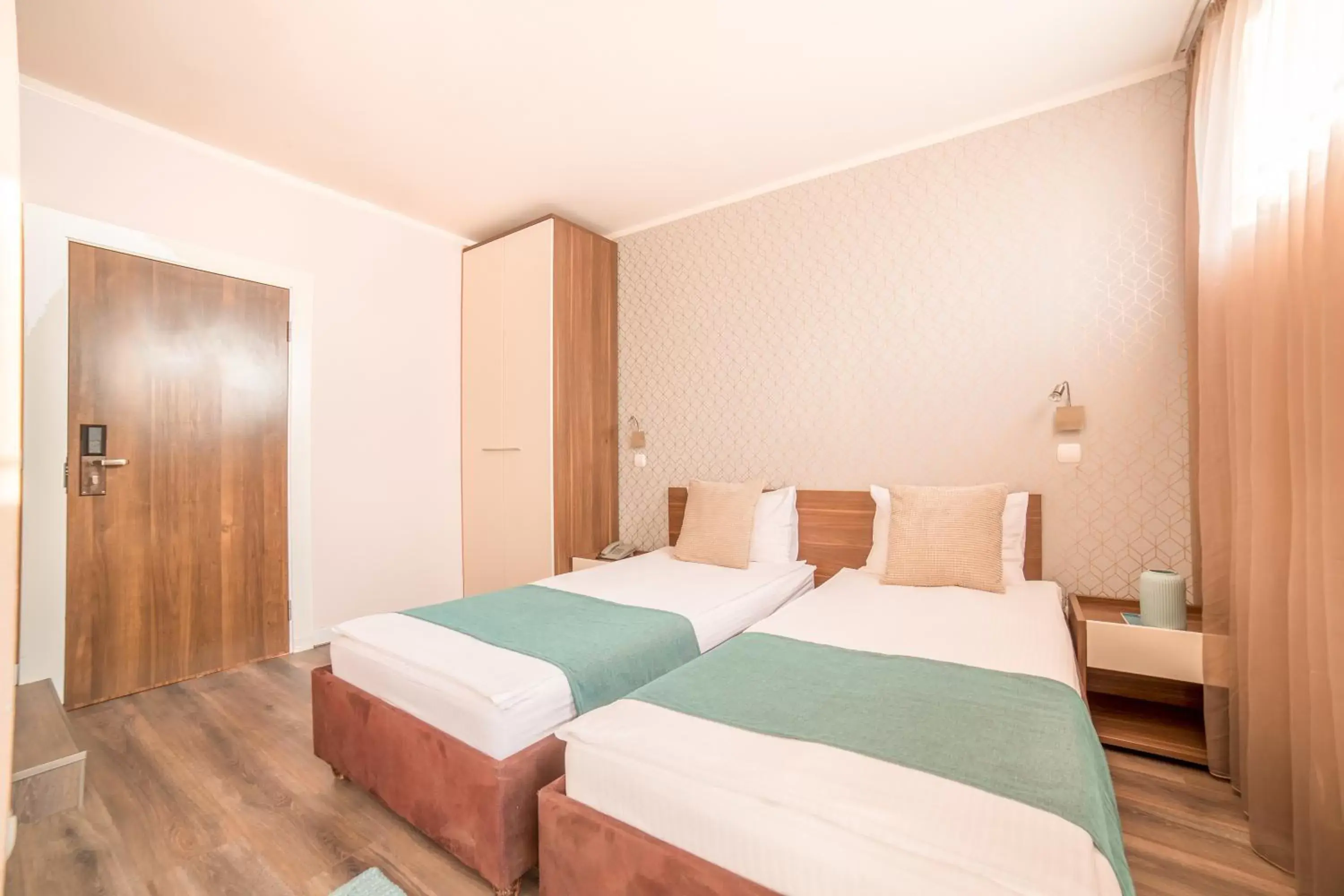 Bed in Balkan Hotel Garni