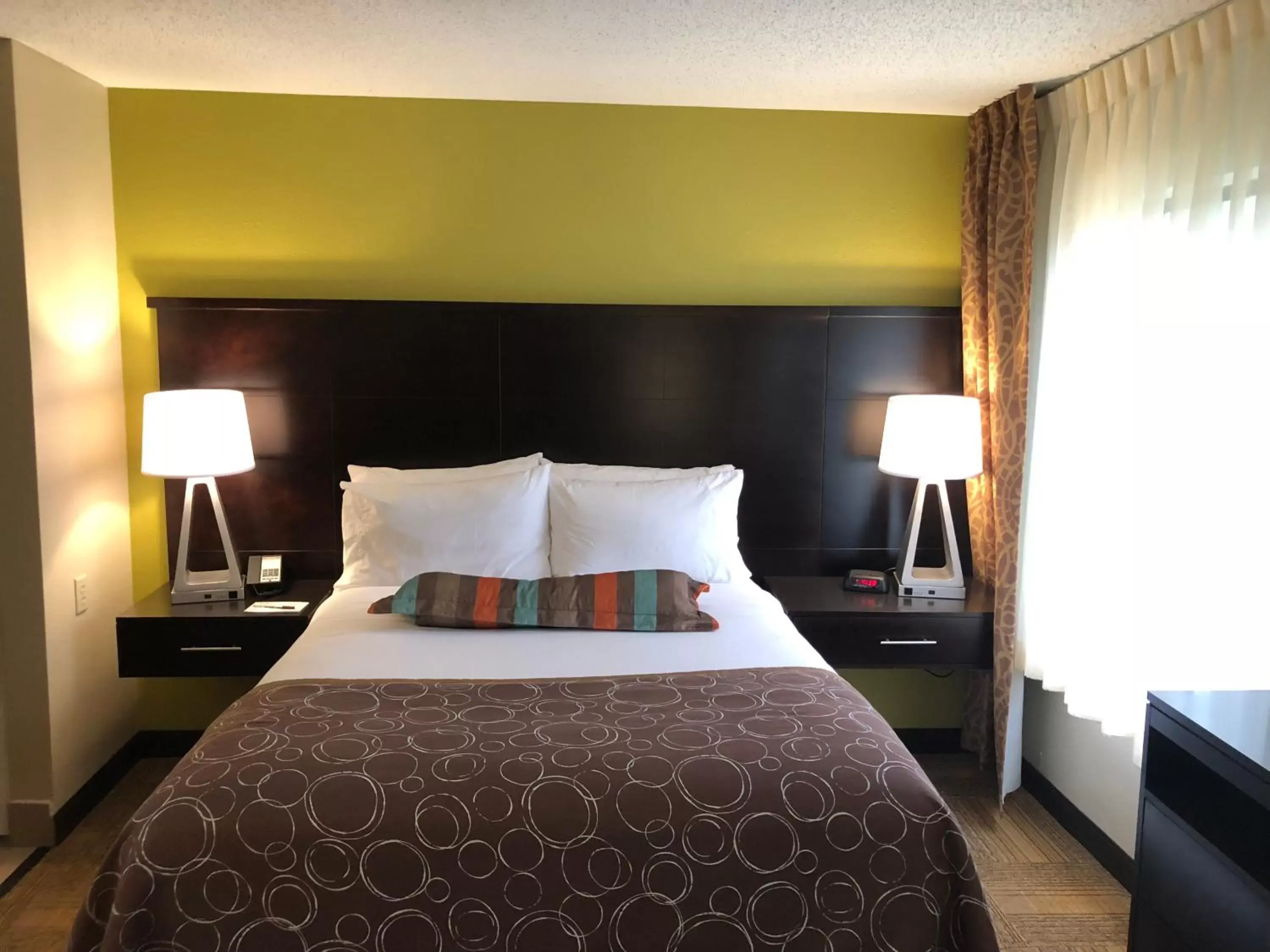 Bed in Staybridge Suites Grand Rapids-Kentwood, an IHG Hotel