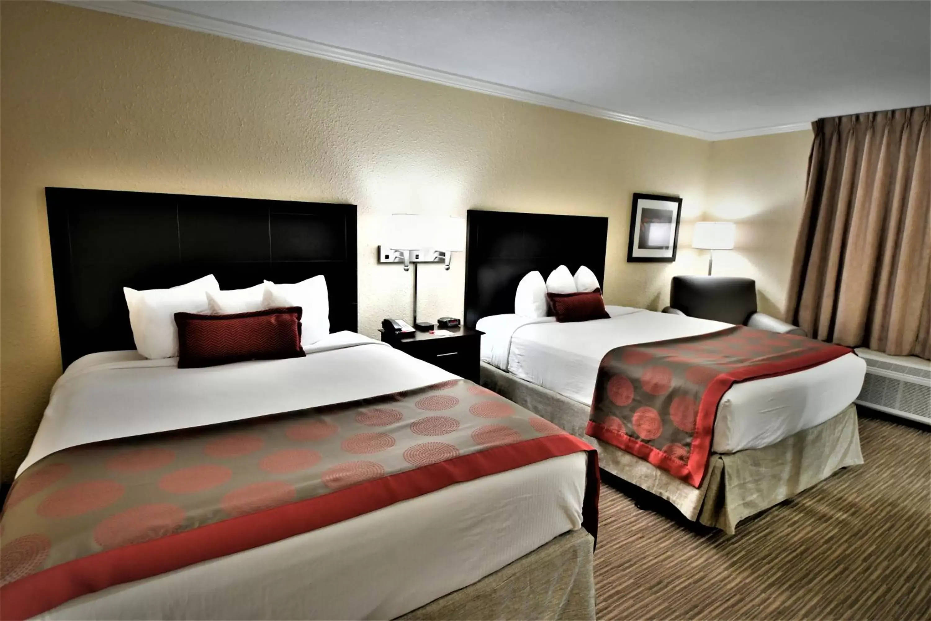 Bed in Ramada by Wyndham Jacksonville Hotel & Conference Center