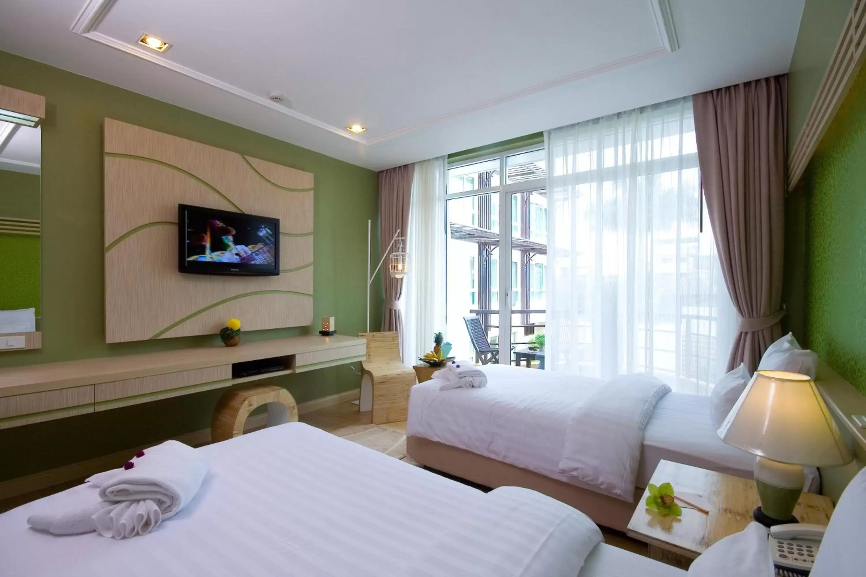 Photo of the whole room, Bed in A-Te Chumphon Hotel - SHA Plus