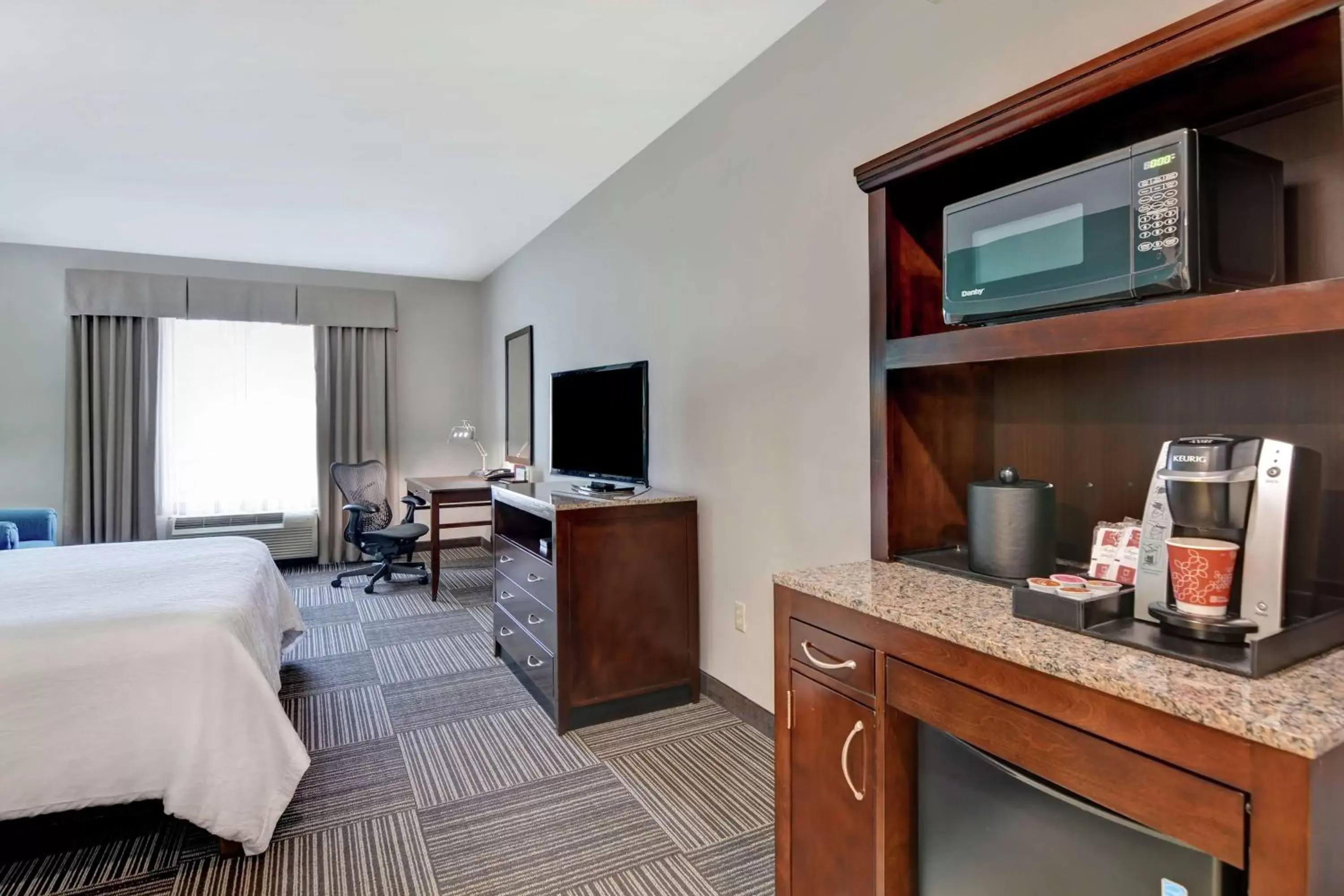 Bedroom, TV/Entertainment Center in Hilton Garden Inn and Fayetteville Convention Center